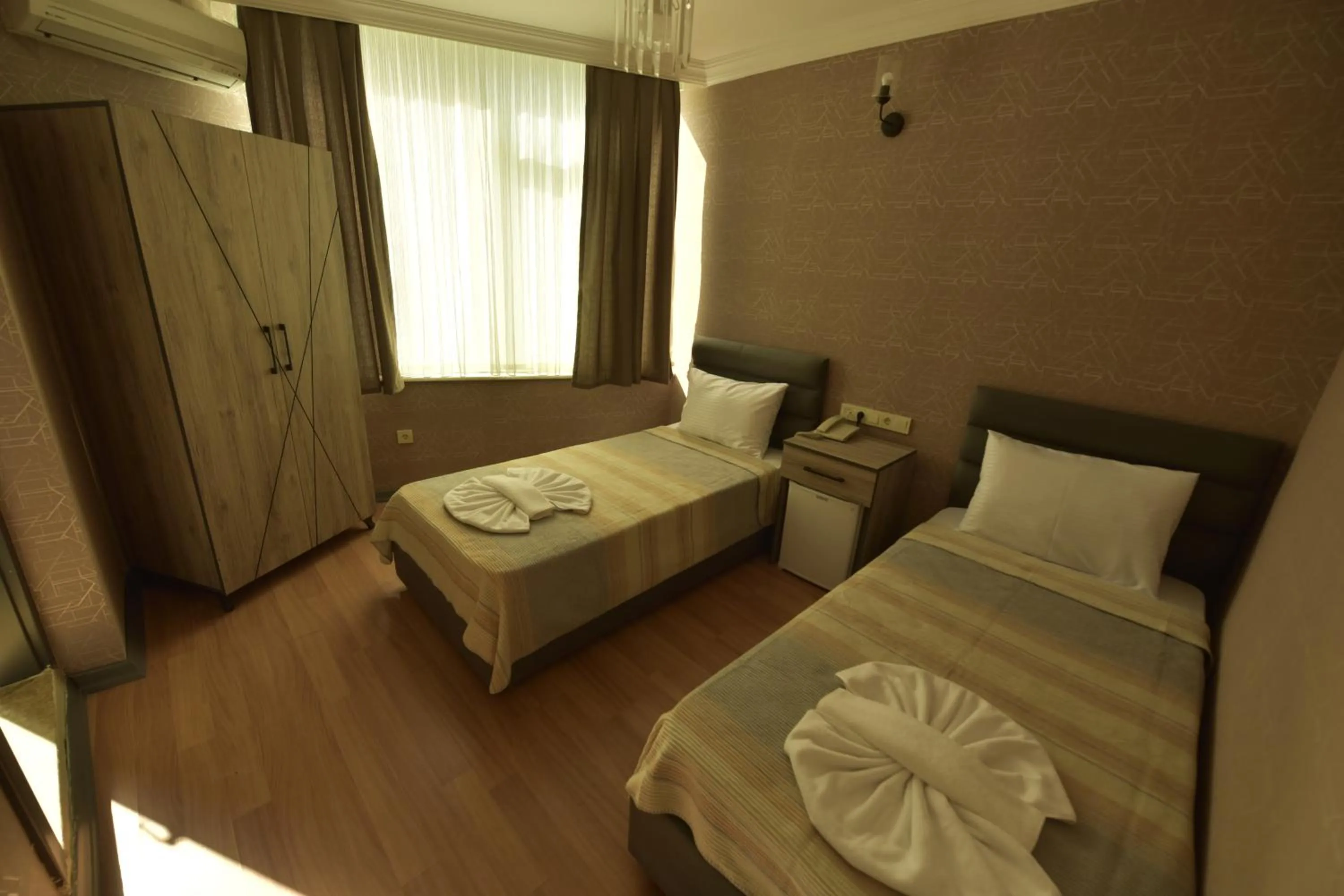 Bed in Omega Luxx Hotel