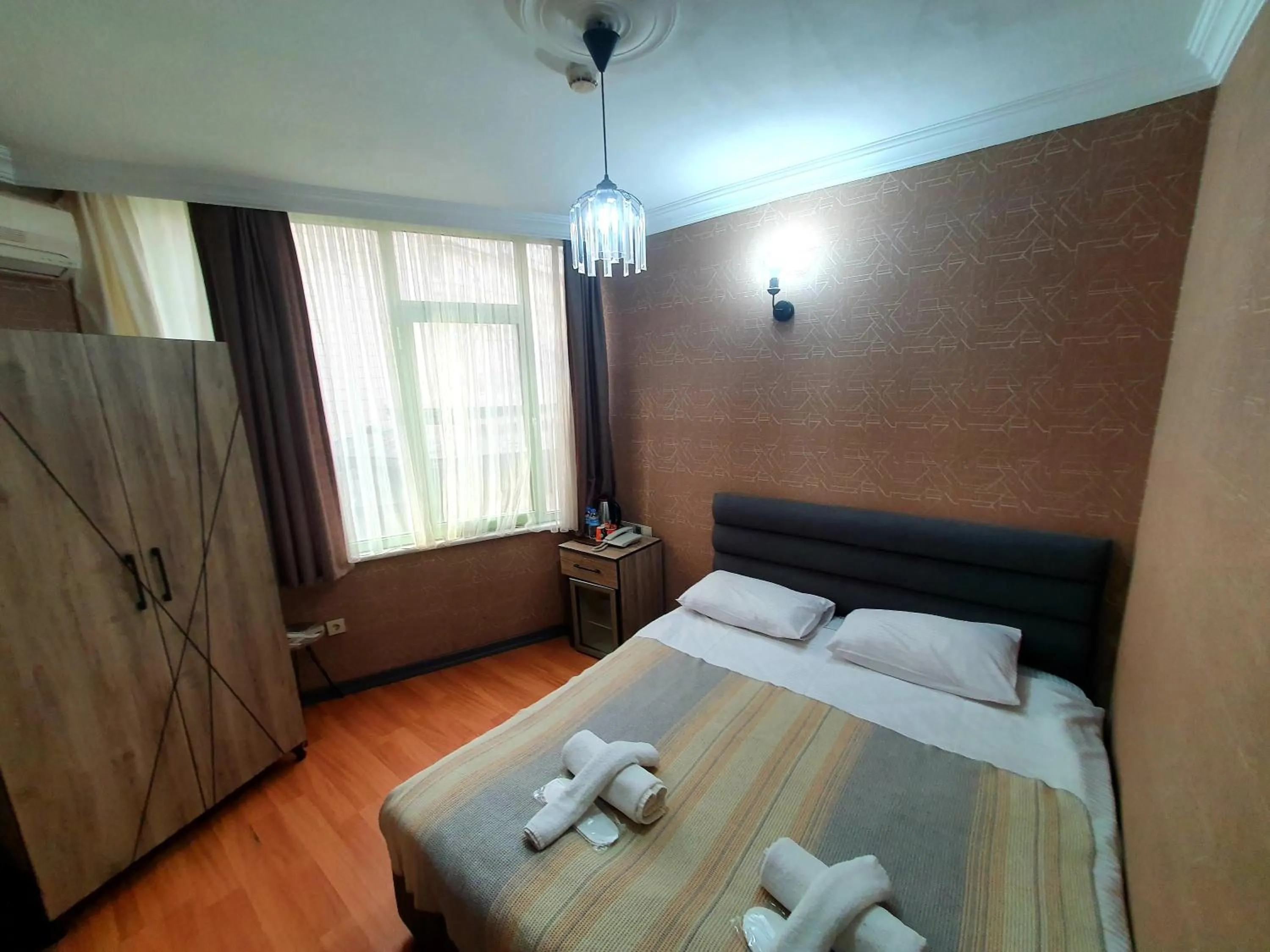 Bedroom, Bed in Omega Luxx Hotel