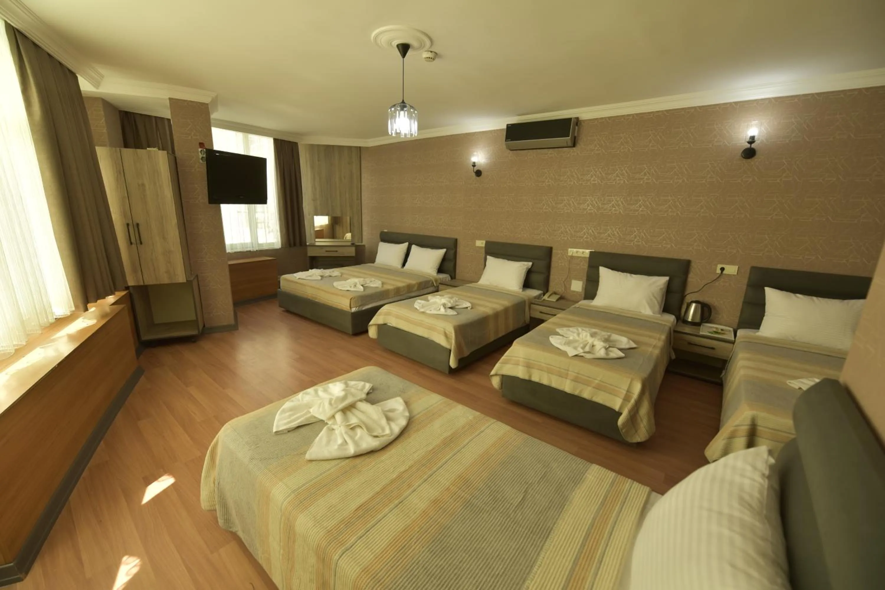 Bed in Omega Luxx Hotel