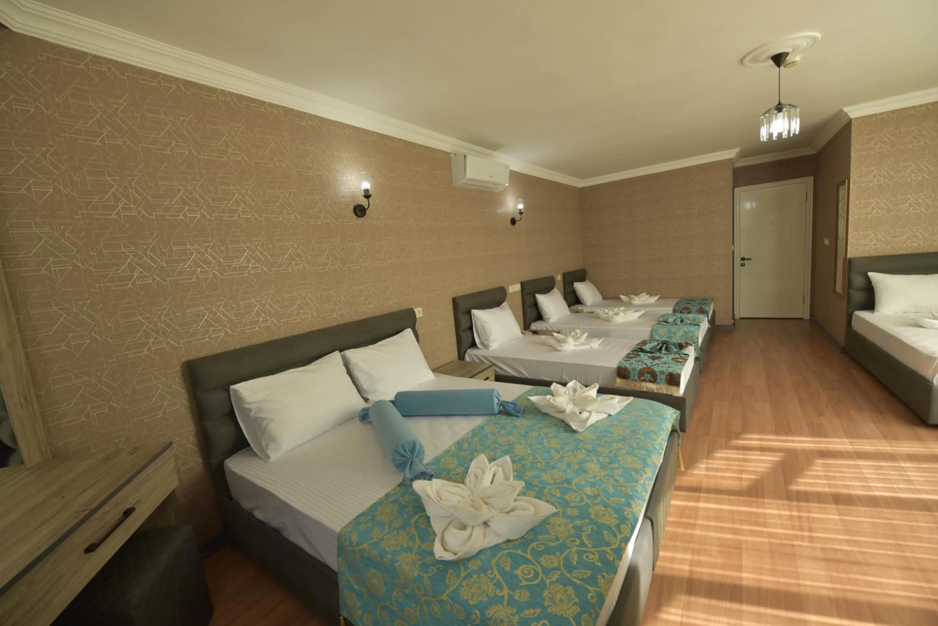 Seating area, Bed in Omega Luxx Hotel