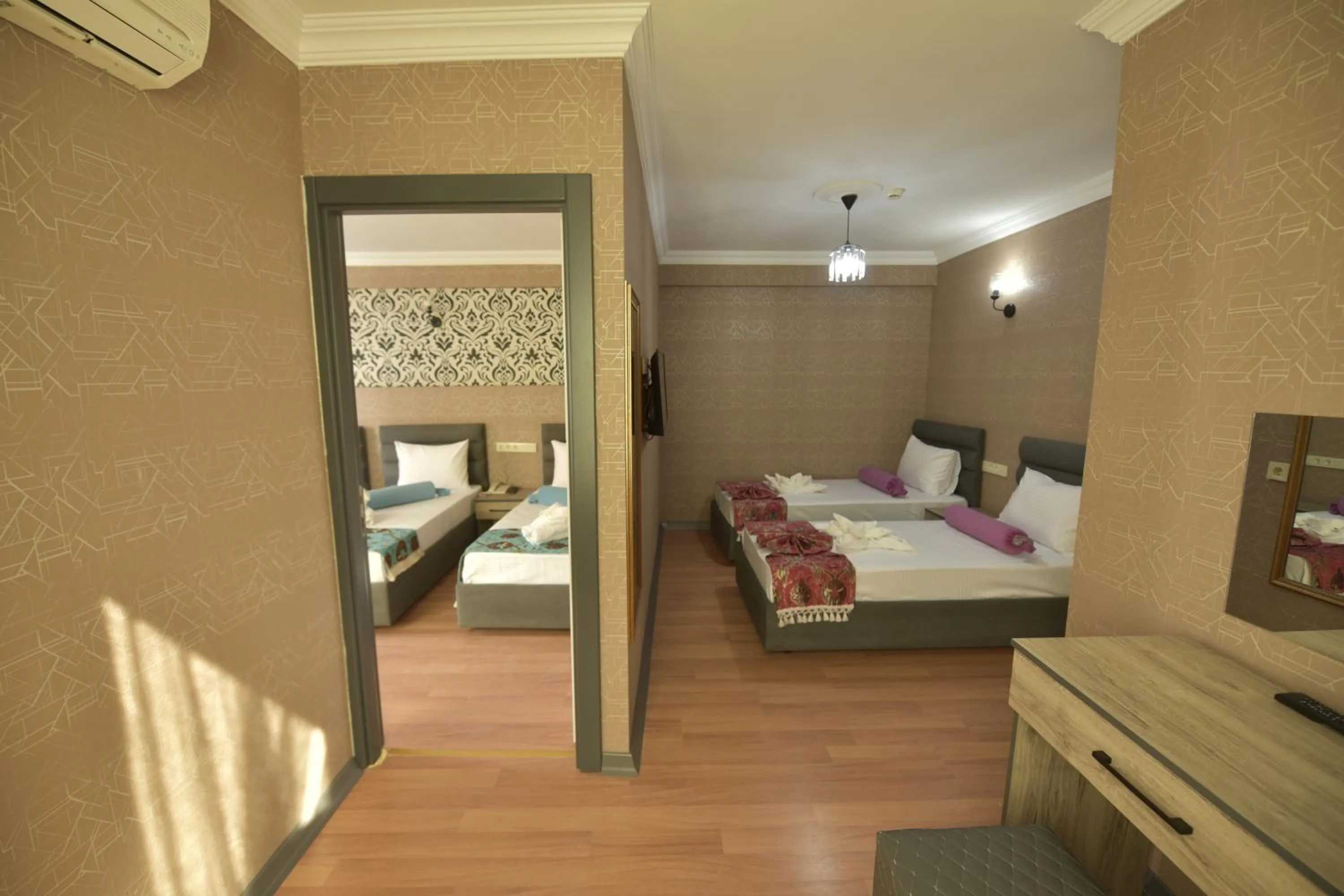 Bed in Omega Luxx Hotel