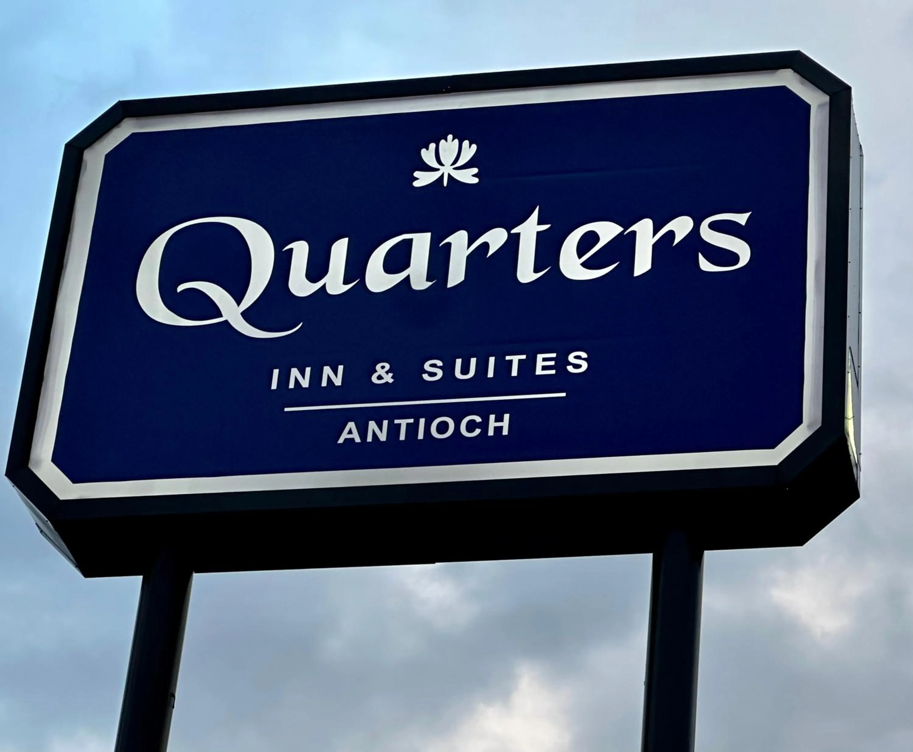 Property logo or sign in Quarters Inn & Suites