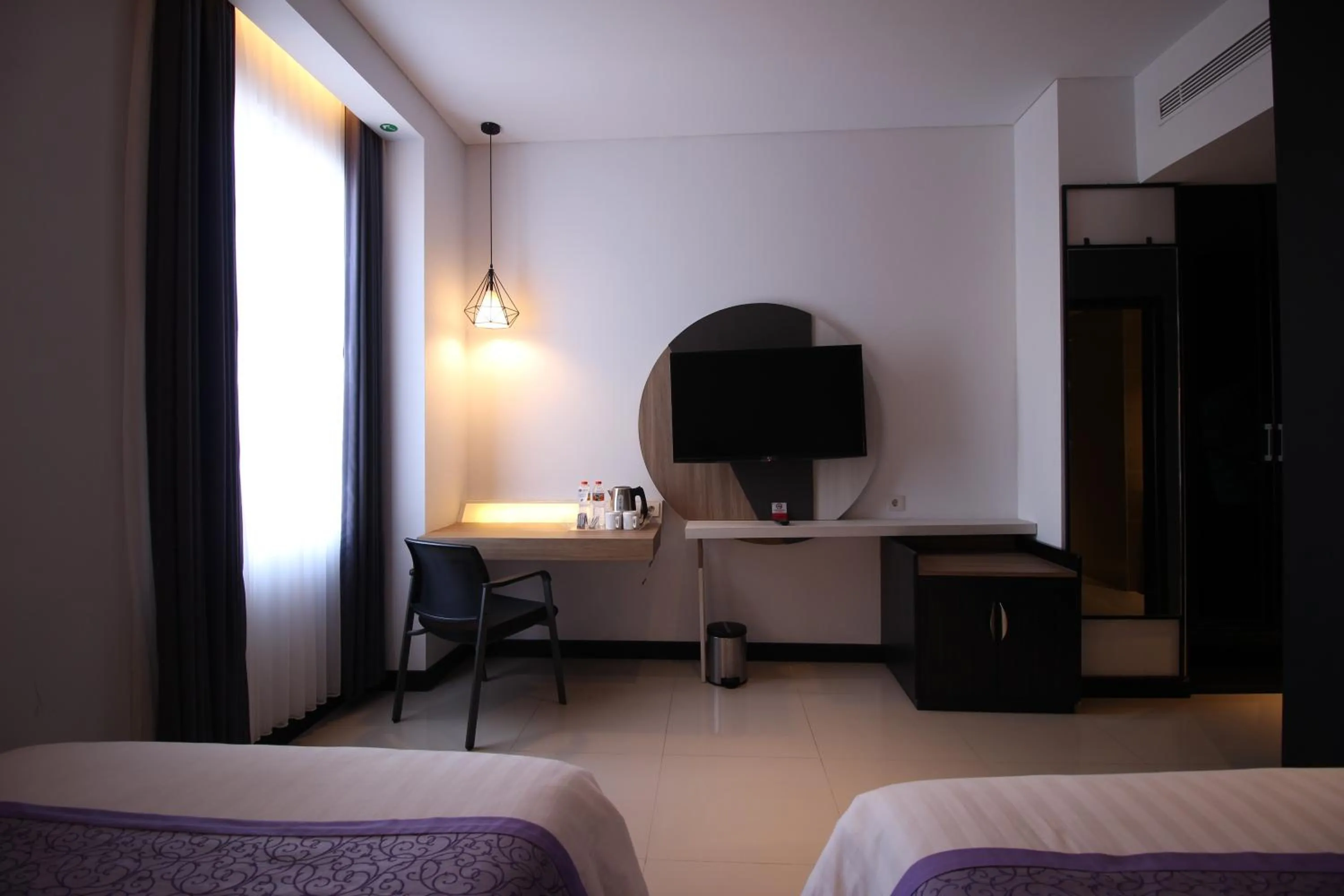 Bed in Forriz Hotel Yogyakarta