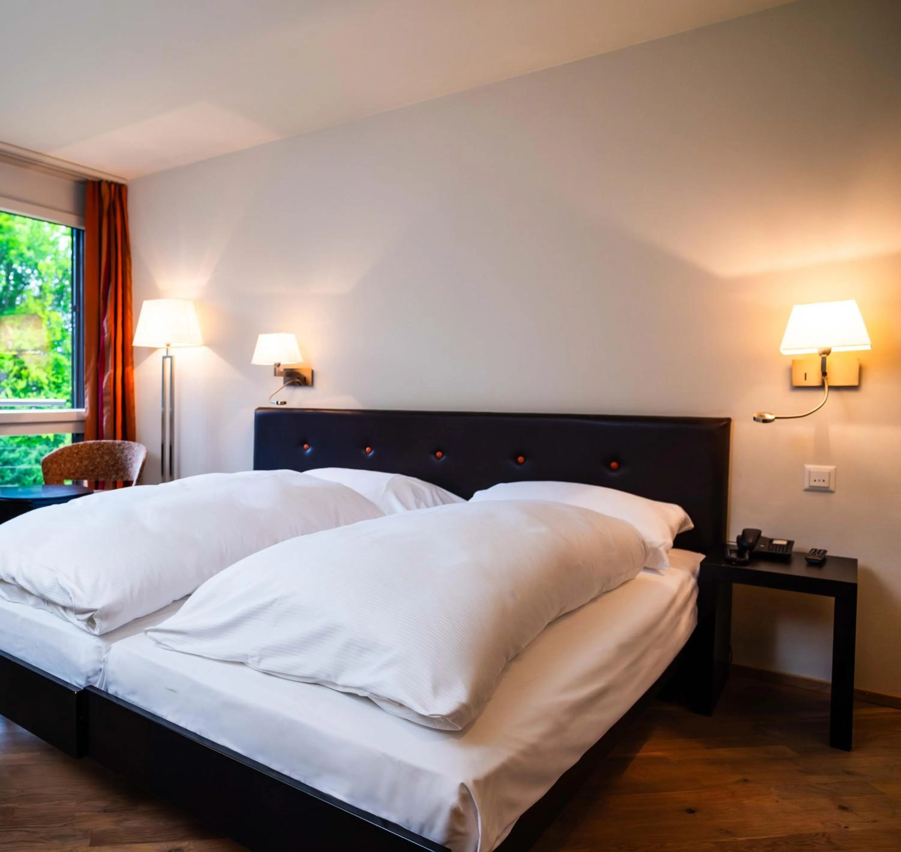 Photo of the whole room, Bed in Hotel Seepark Thun