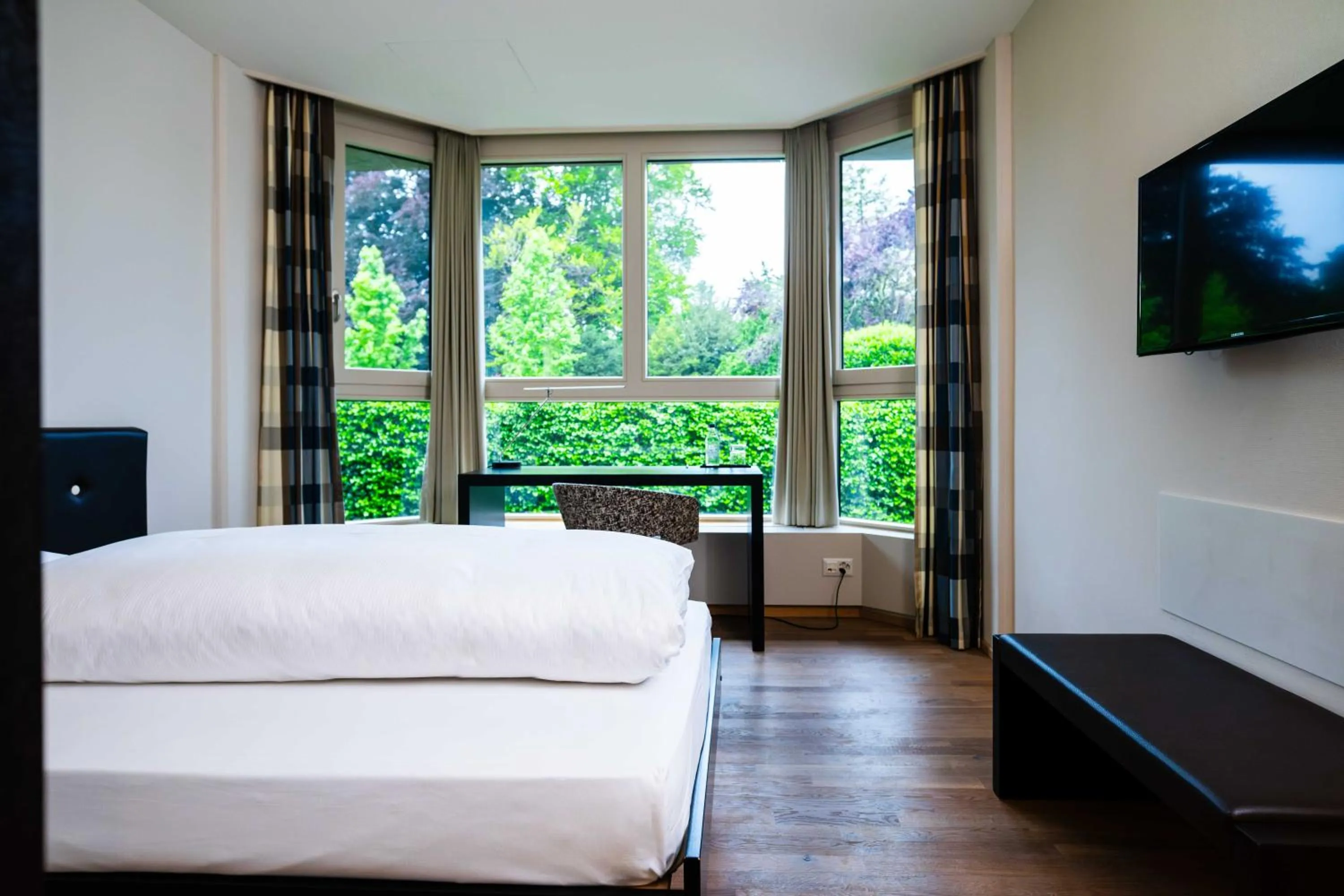 Photo of the whole room, Bed in Hotel Seepark Thun