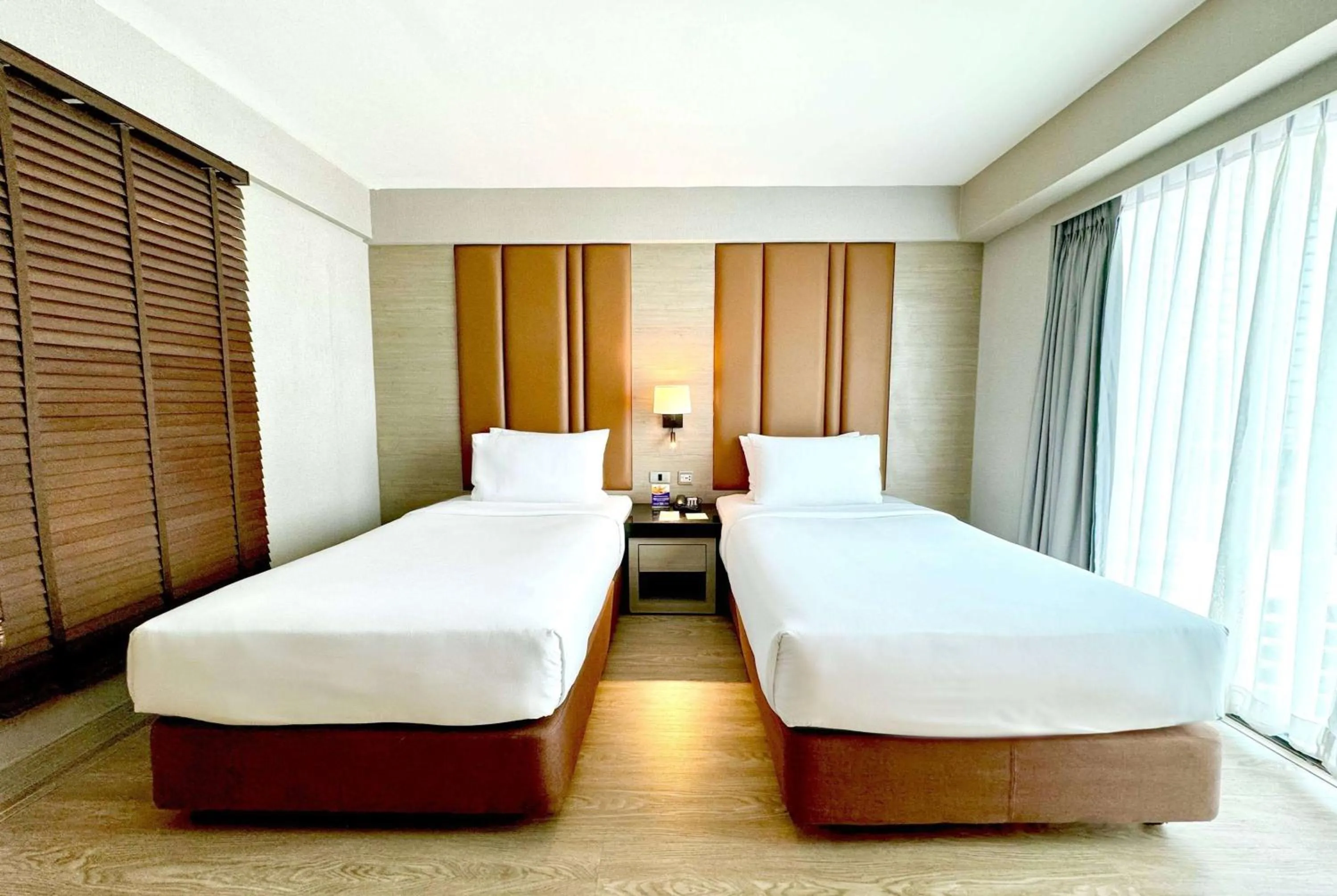 Photo of the whole room, Bed in Ramada Sukhumvit Soi Eleven