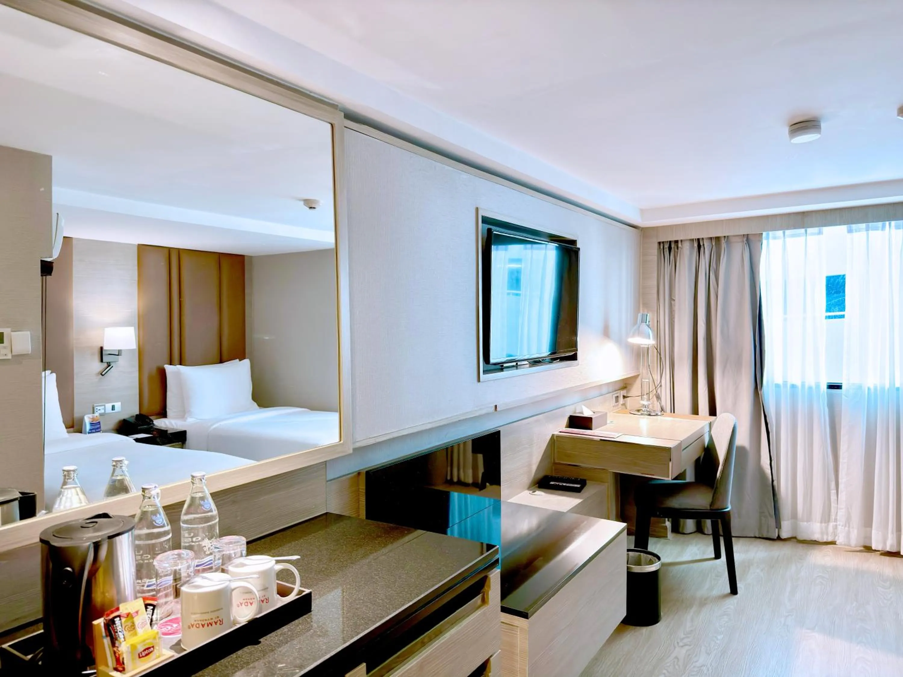 Living room, Bed in Ramada Sukhumvit Soi Eleven