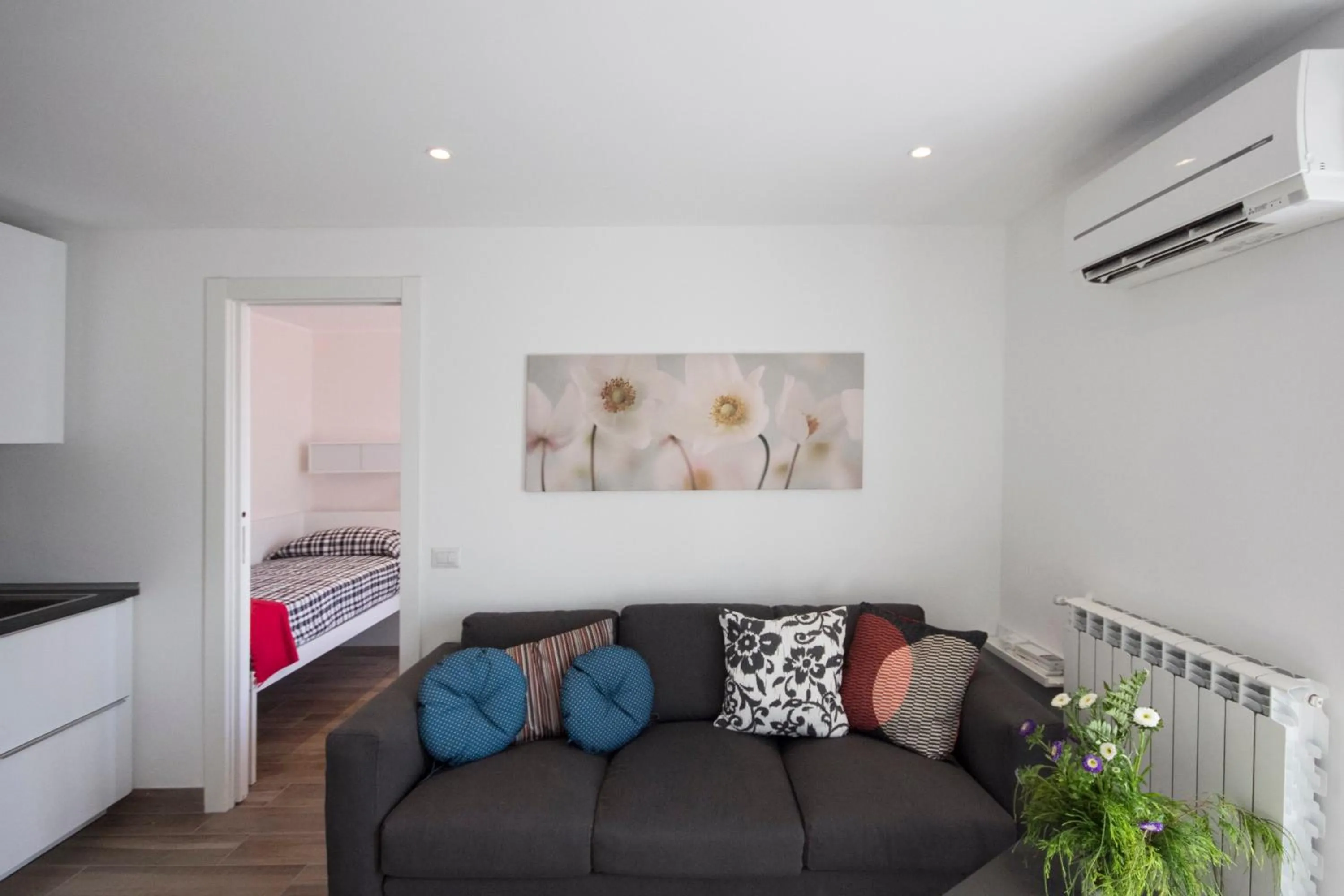 Living room, Bed in Appartamenti Meraviglia