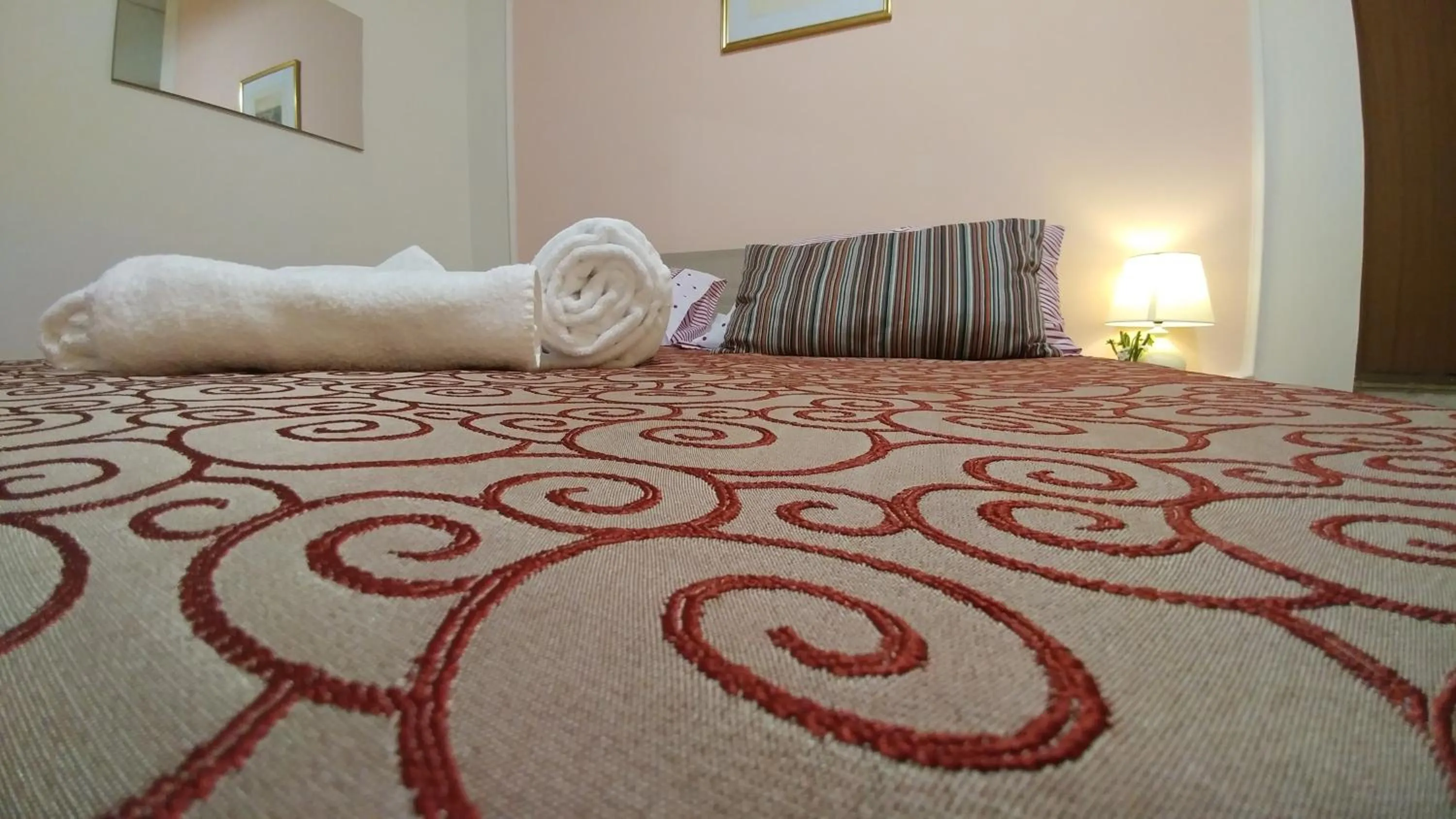 Decorative detail, Bed in Dreaming Navona Rooms