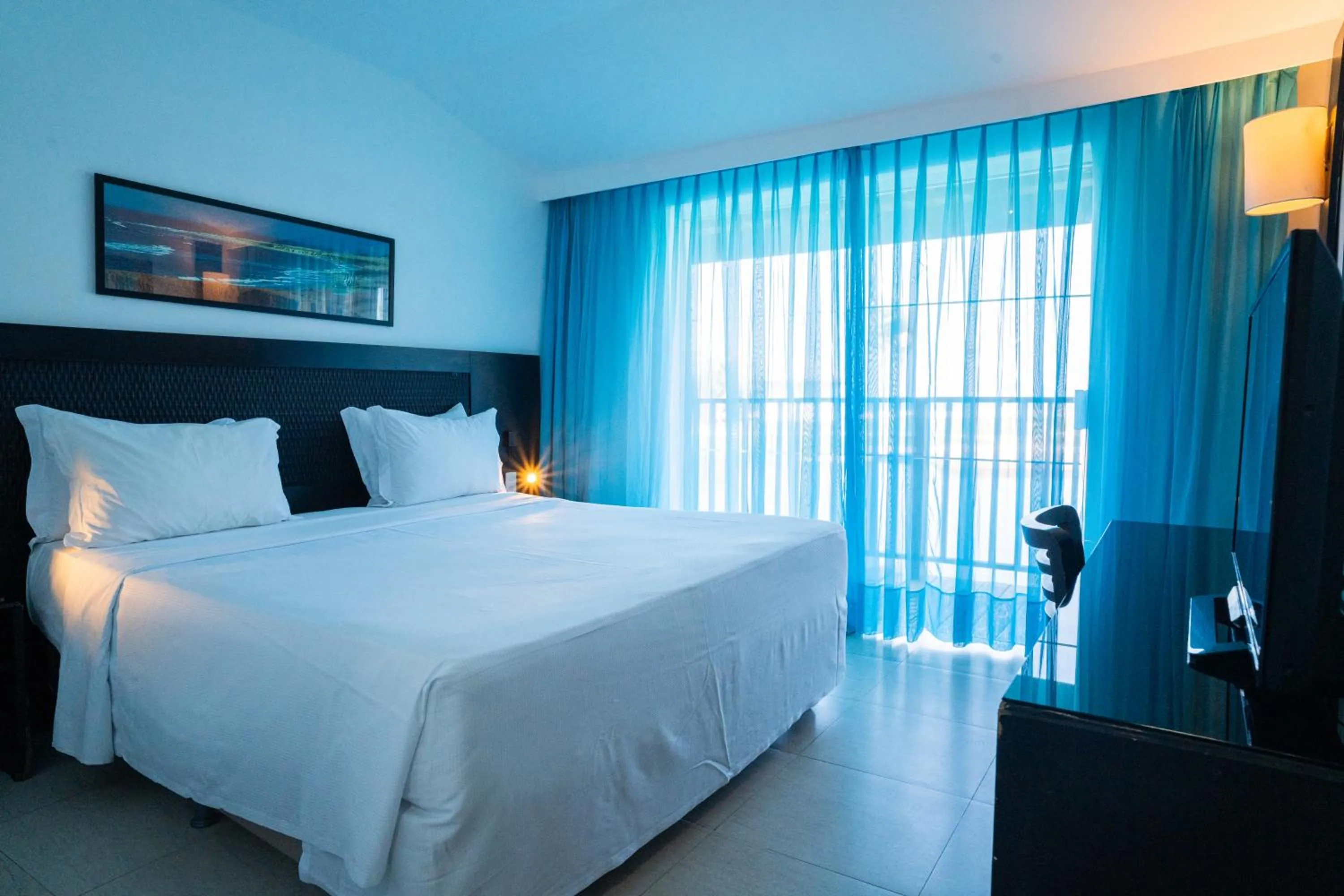 Bed in Dom Pedro Laguna Beach Resort & Golf by WAM Experience