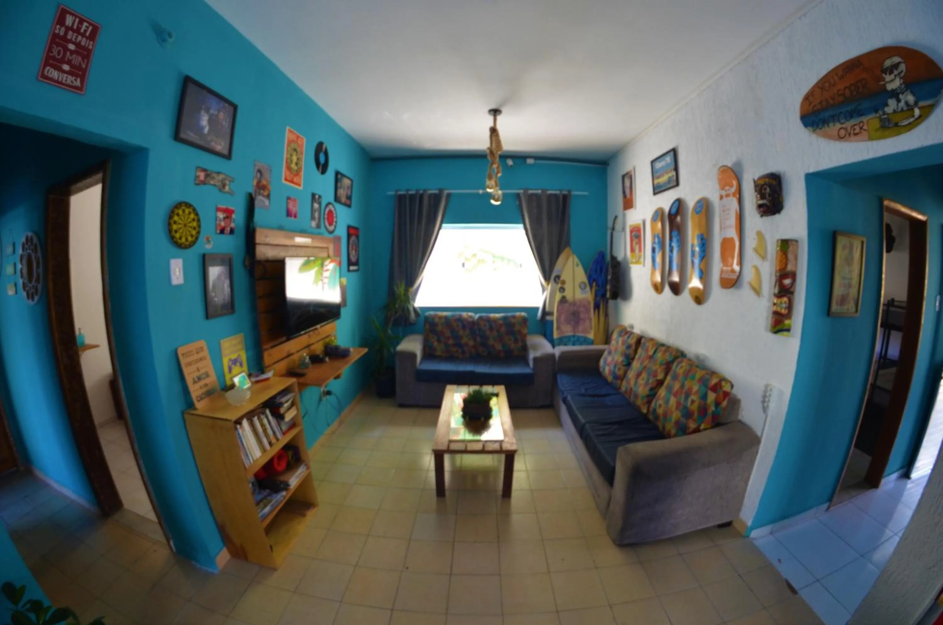 Communal lounge/ TV room in La Casa Hostel