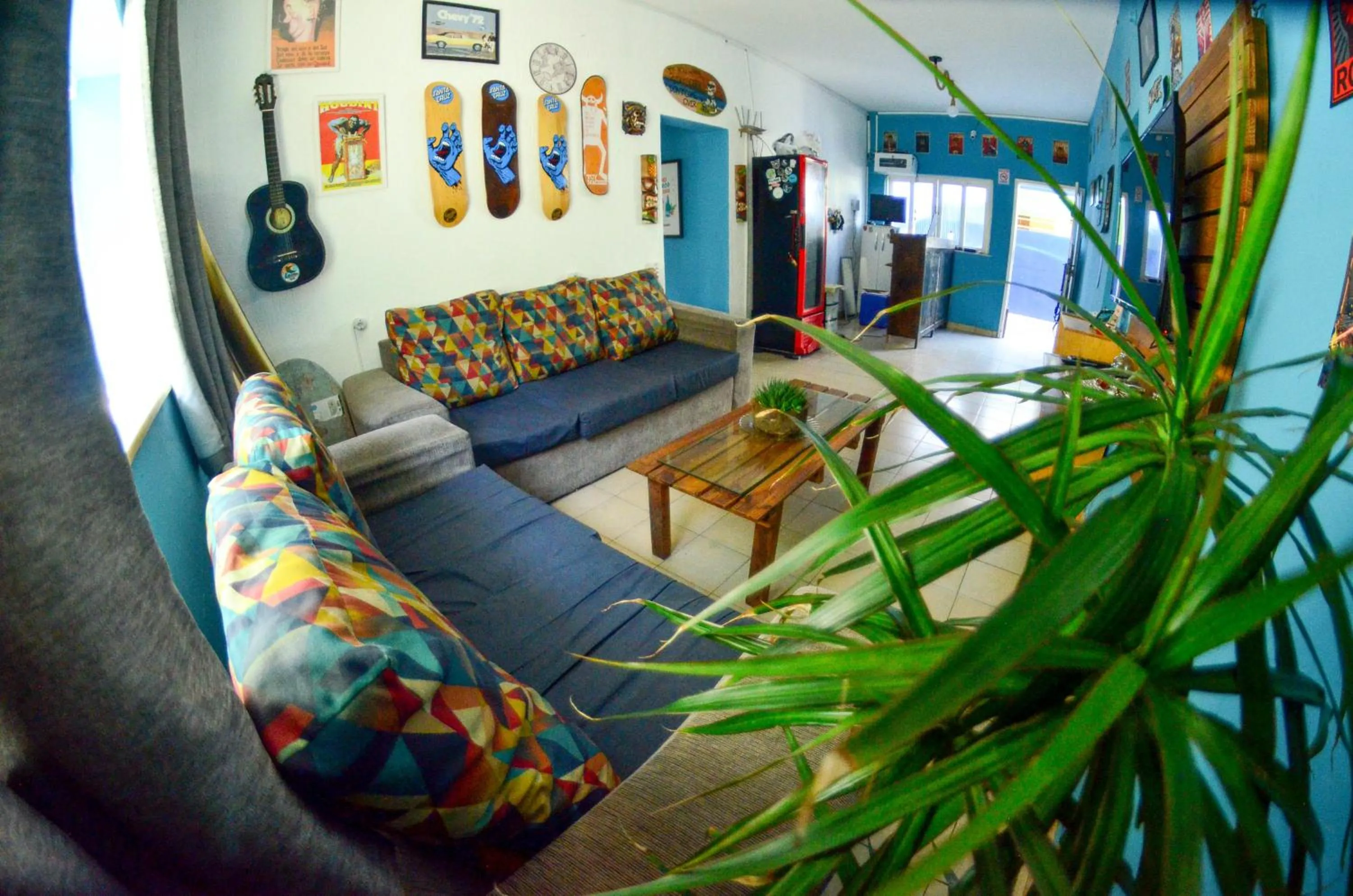 Communal lounge/ TV room in La Casa Hostel