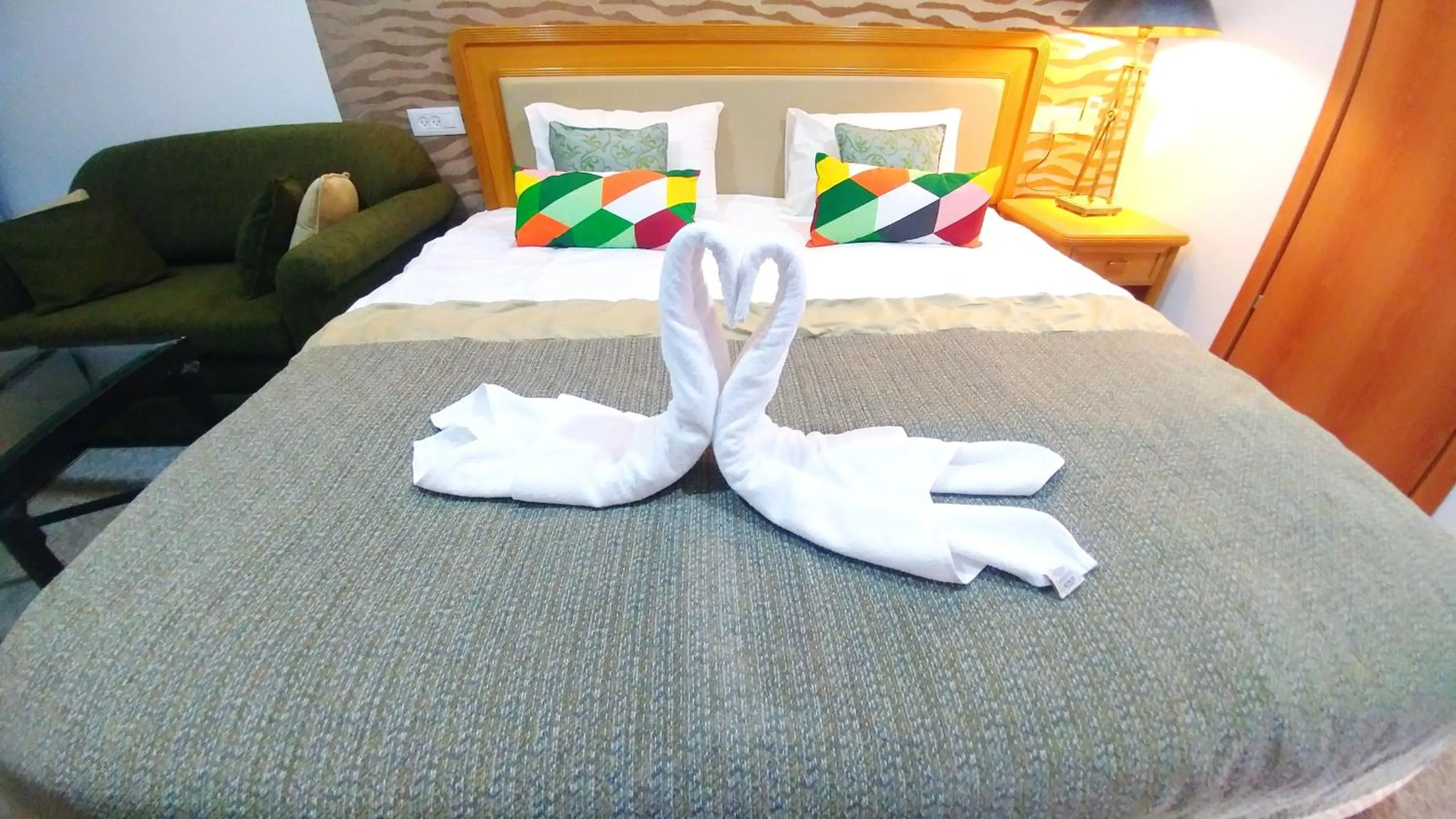 Photo of the whole room, Bed in City Suites