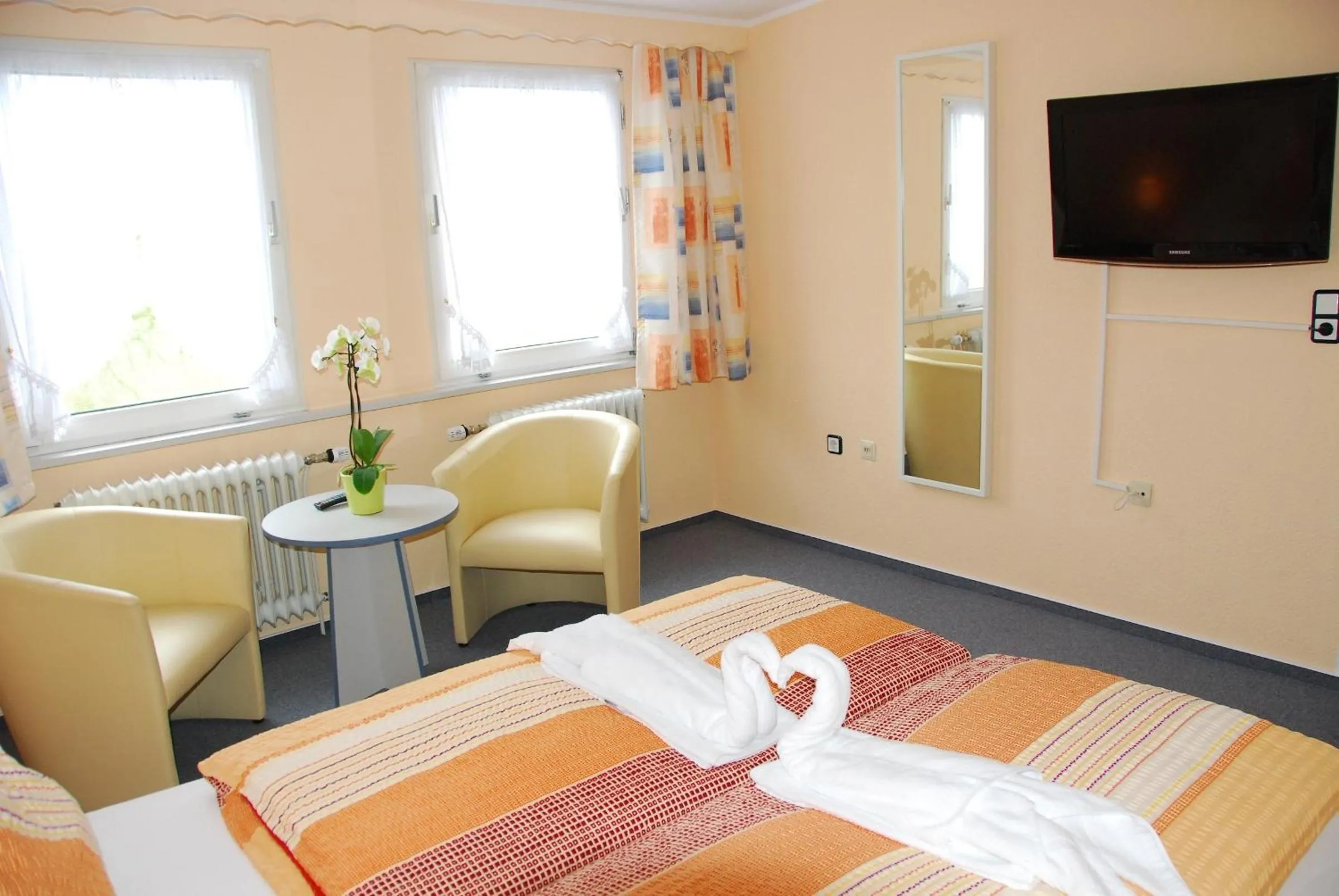 Photo of the whole room, Bed in Hotel Norden Norddeich