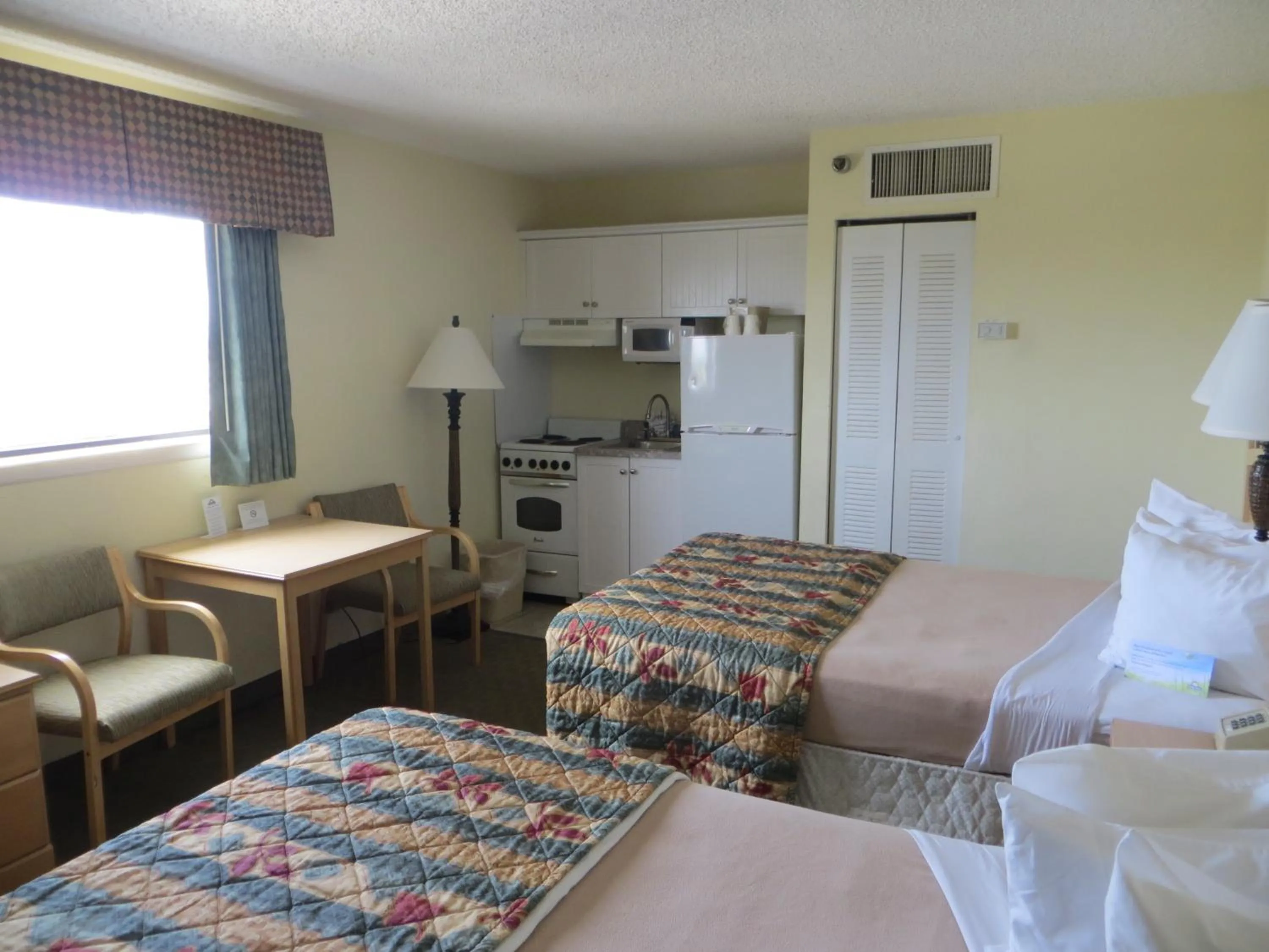 Bed in Days Inn by Wyndham Daytona Oceanfront