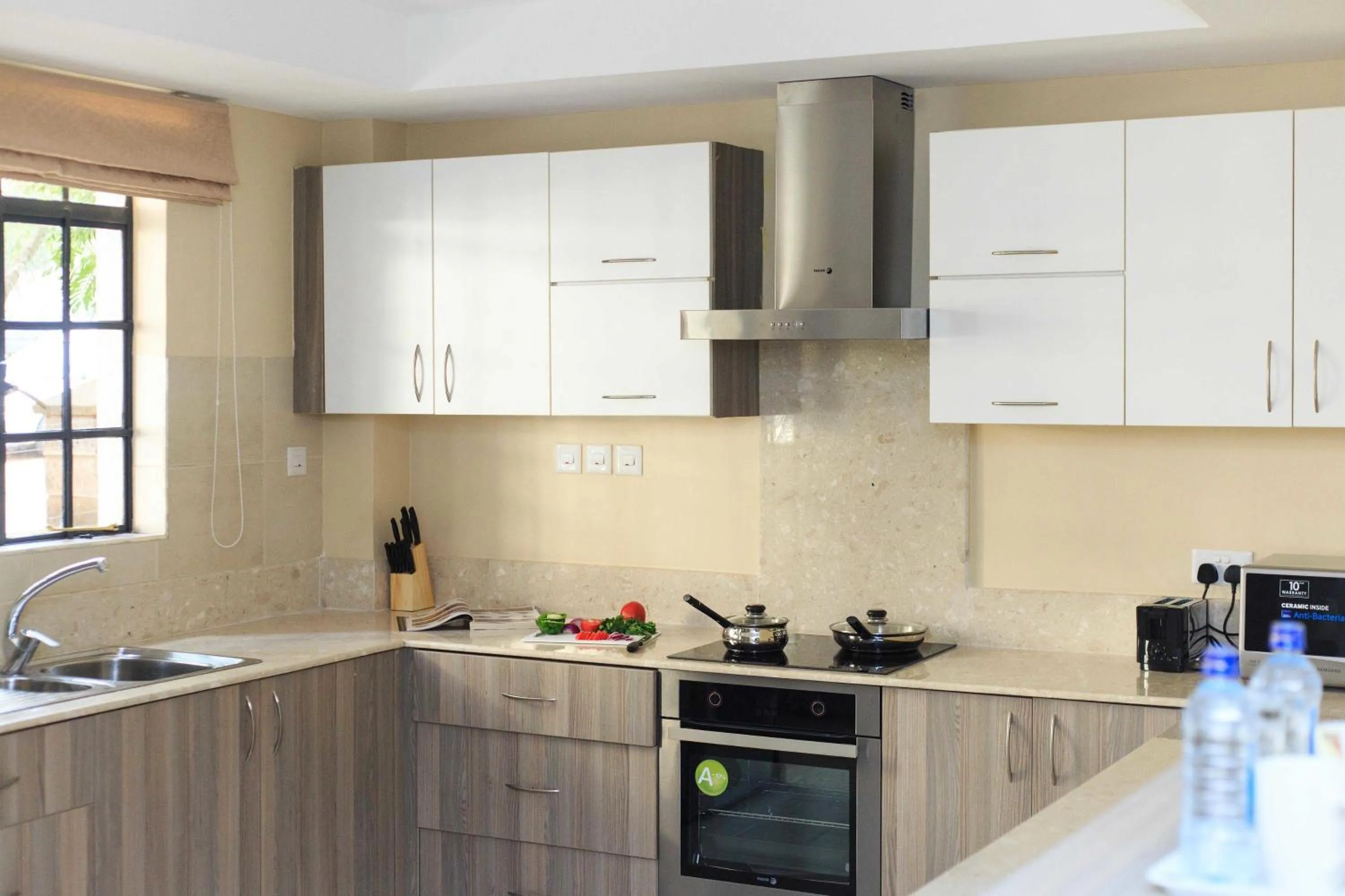 Kitchen or kitchenette in Cozy Residences by Trianum