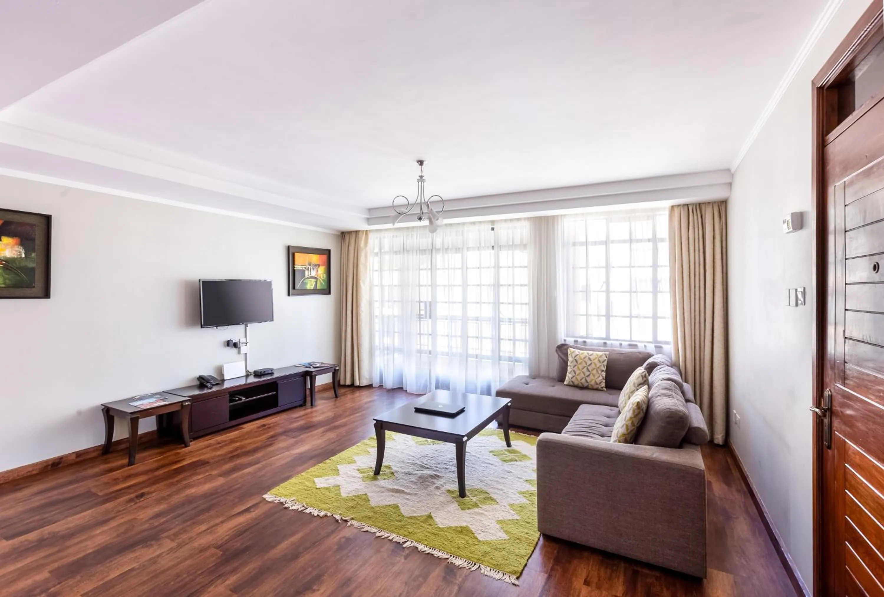 Living room in Cozy Residences by Trianum