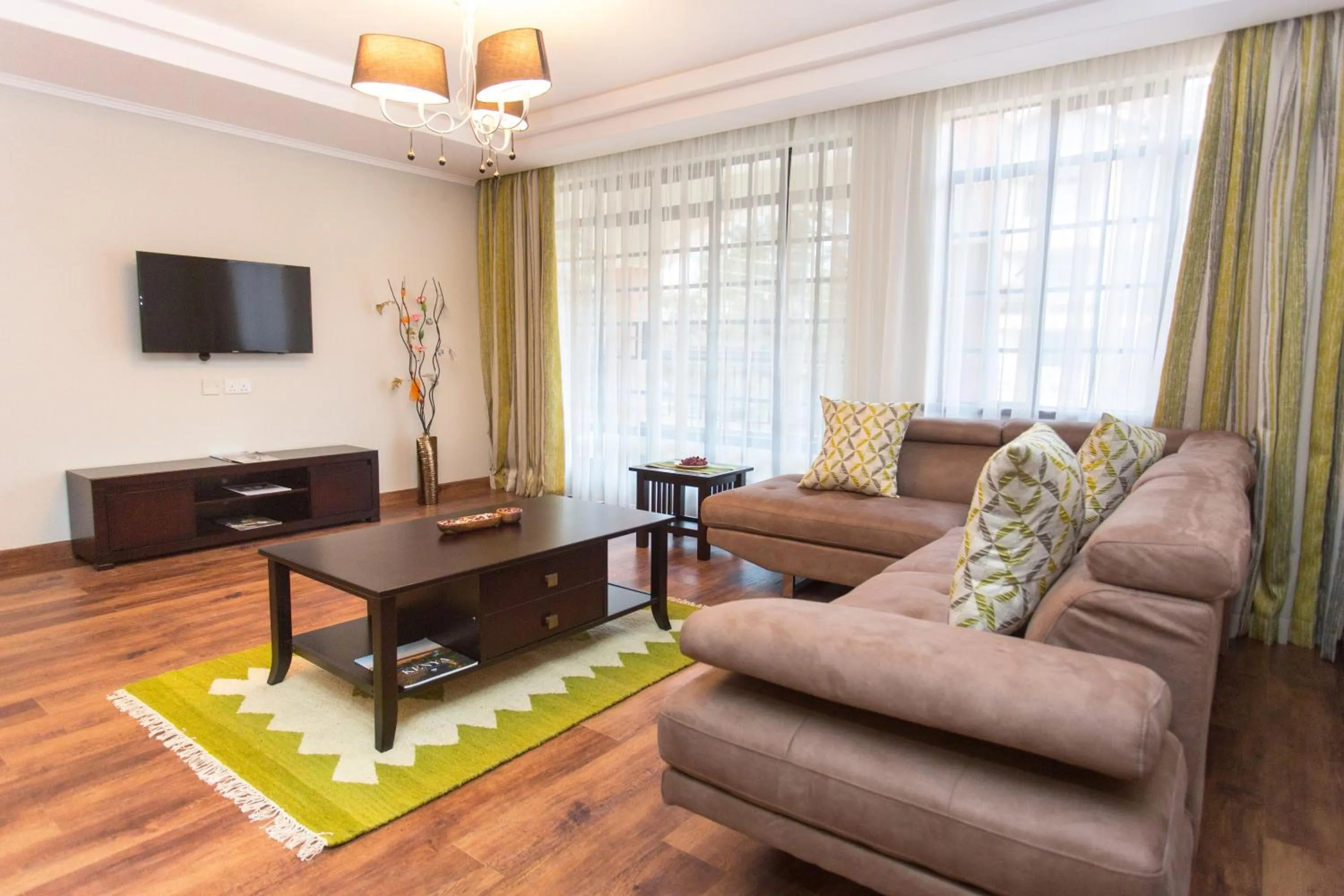 Living room in Cozy Residences by Trianum