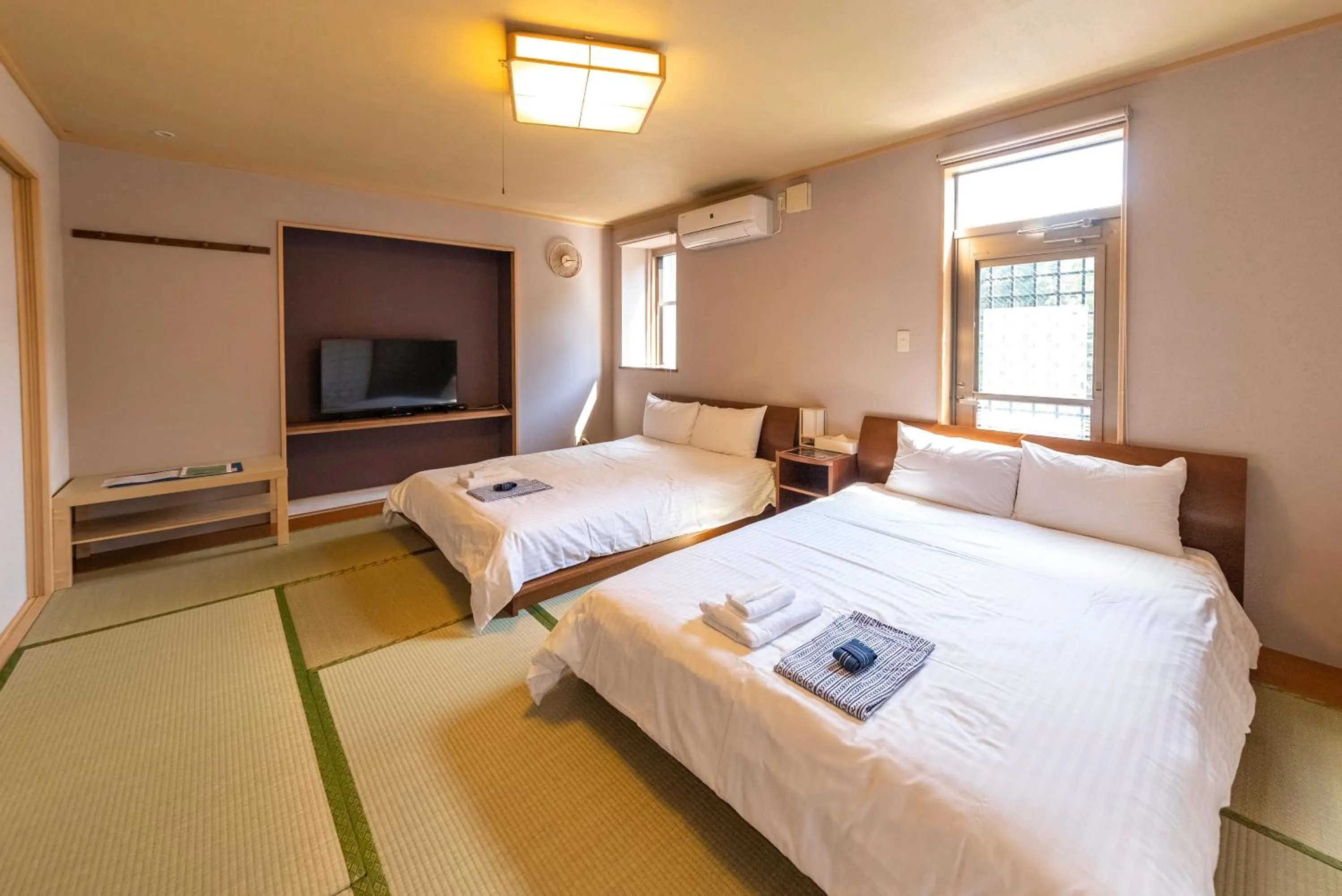 Photo of the whole room, Bed in ETAVIA Yufuin Kinrinko