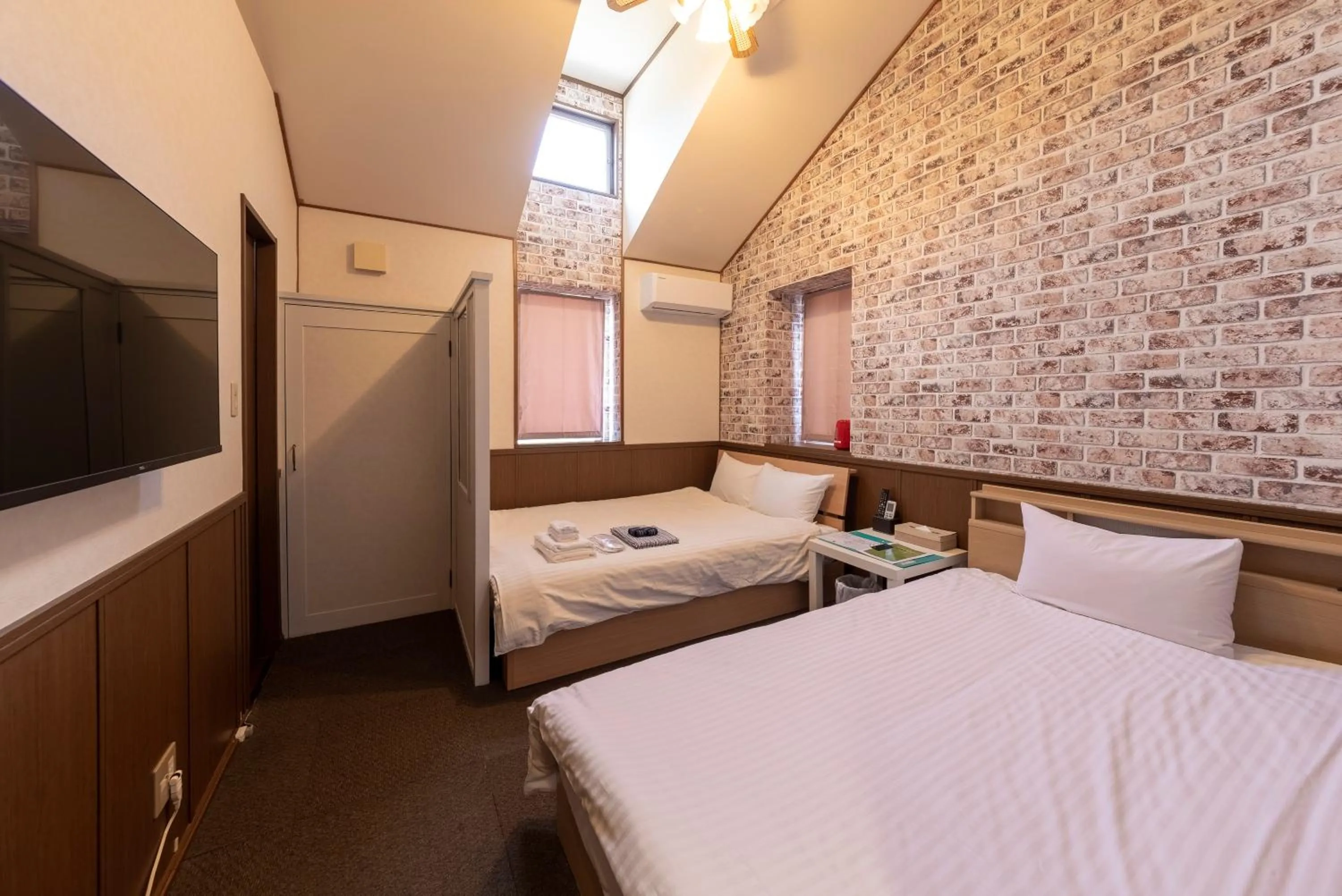 Photo of the whole room, Bed in ETAVIA Yufuin Kinrinko