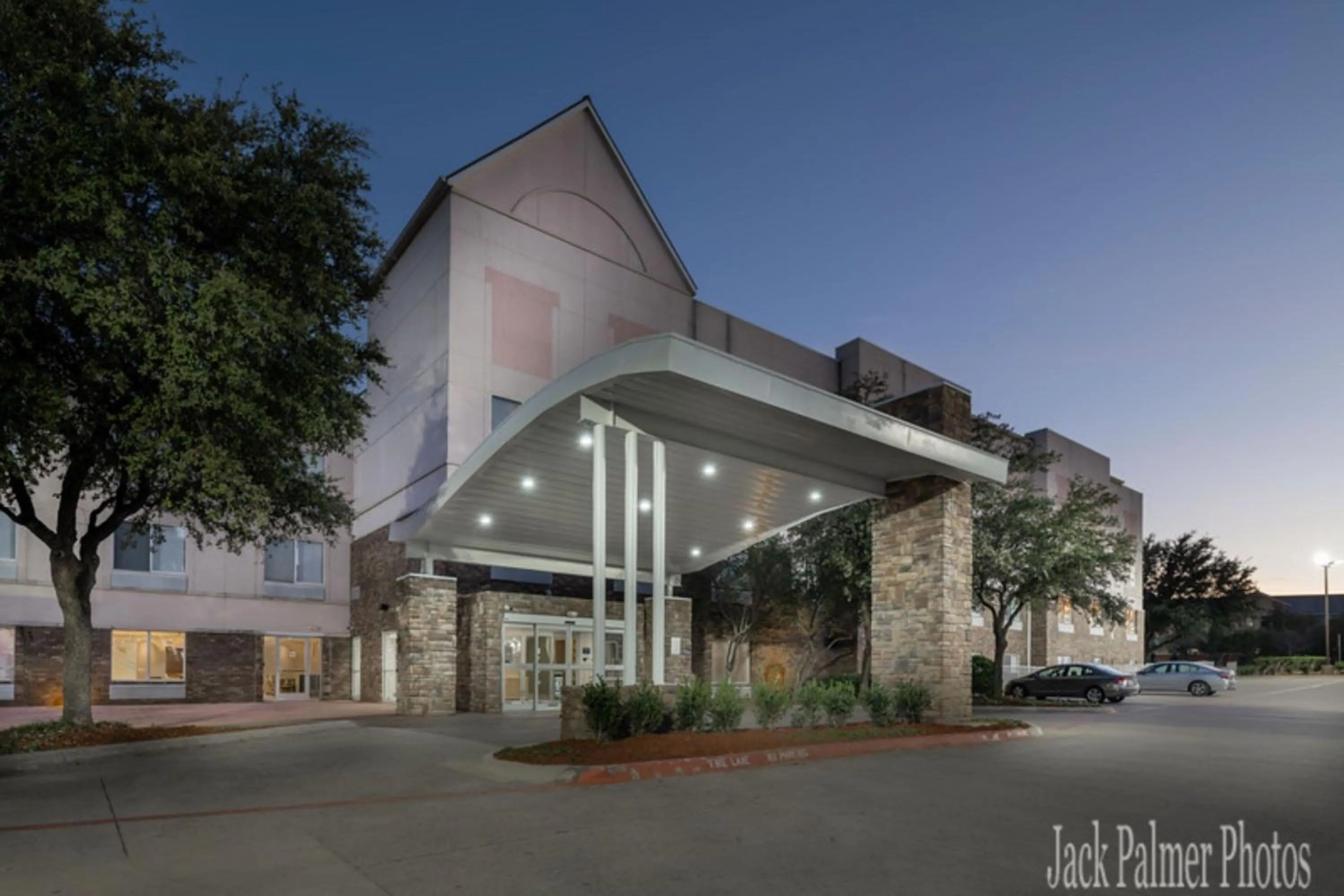 Property building in Las Colinas Inn Irving, SureStay Collection by Best Western