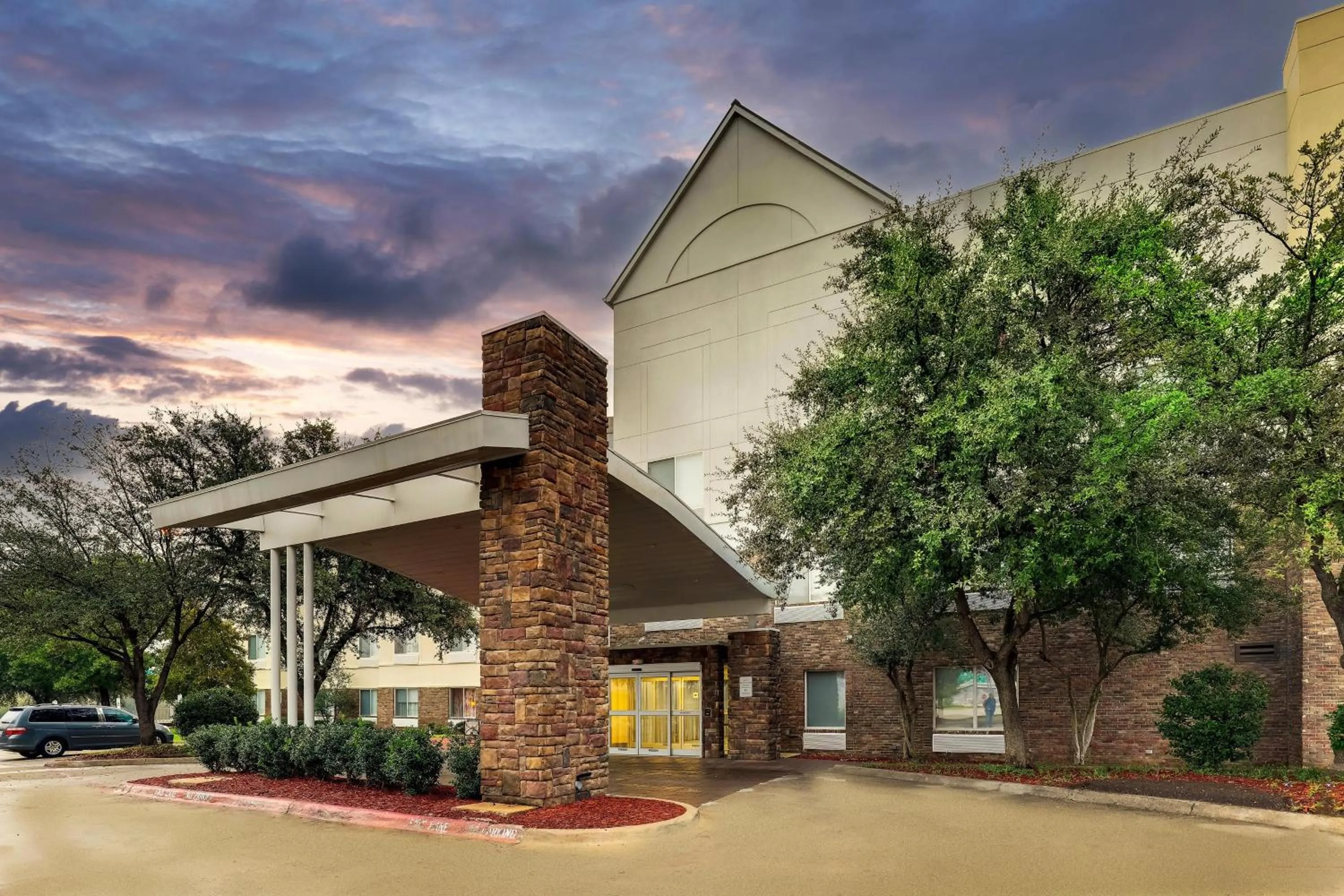 Property building in Las Colinas Inn Irving, SureStay Collection by Best Western