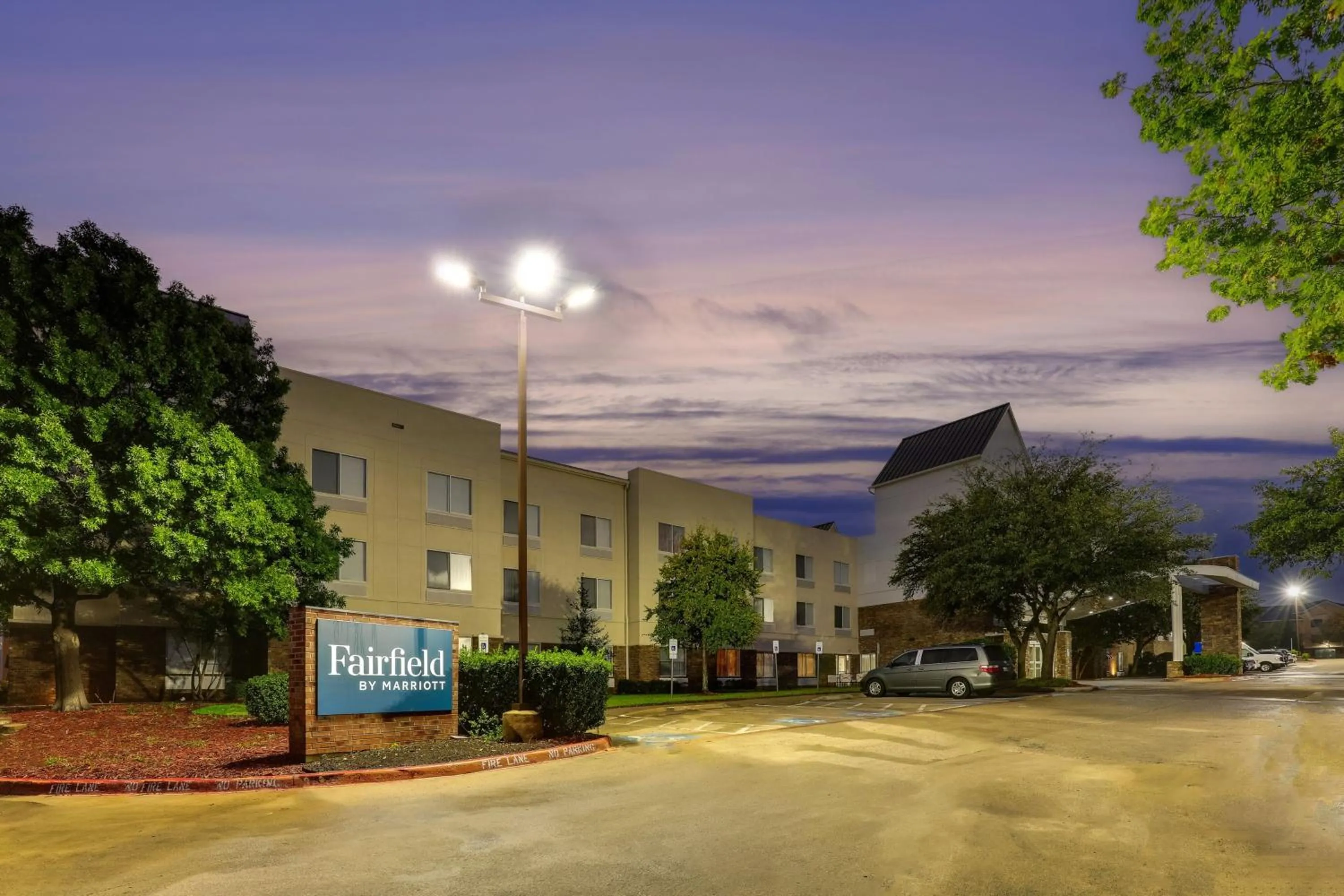 Property building in Las Colinas Inn Irving, SureStay Collection by Best Western