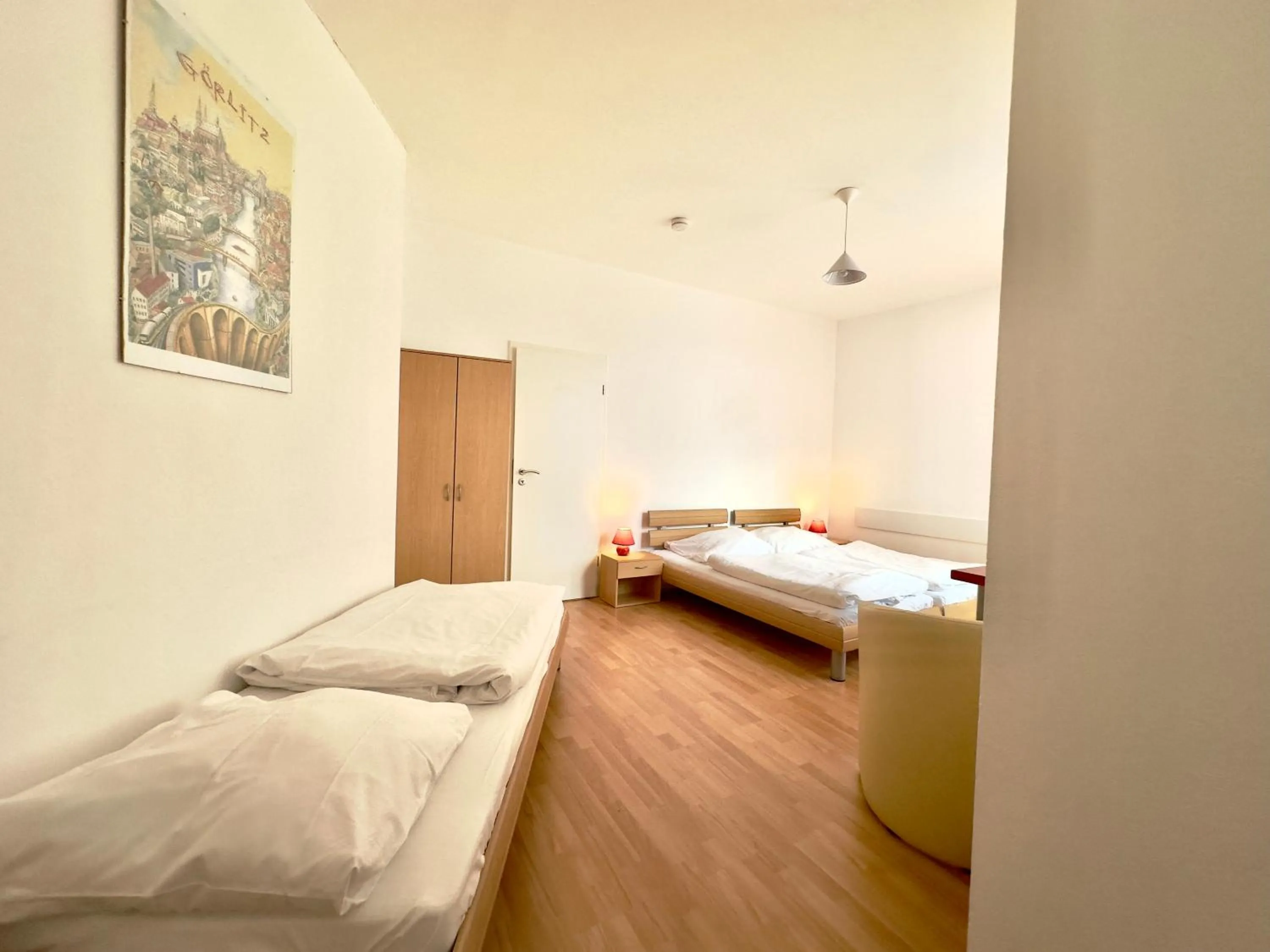 Seating area, Bed in Picobello Pension