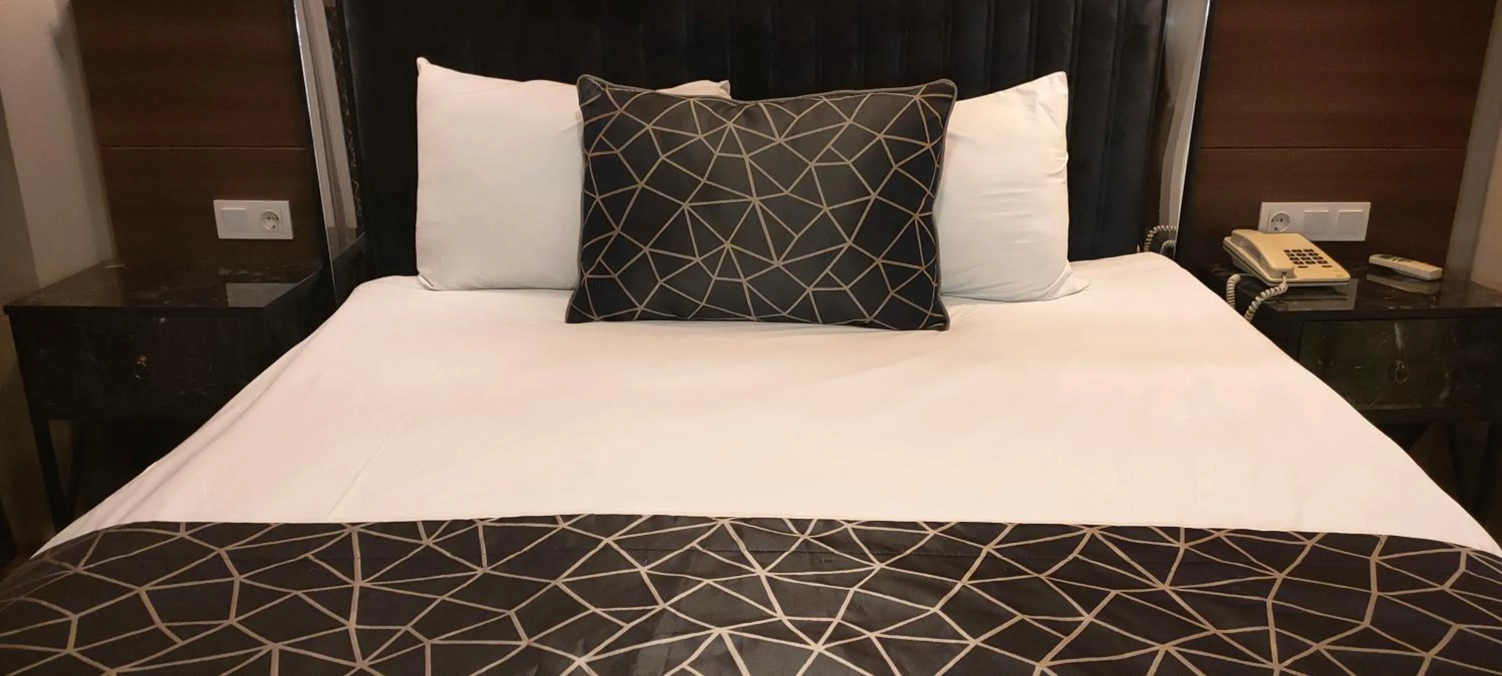 Bed in Star City Hotel