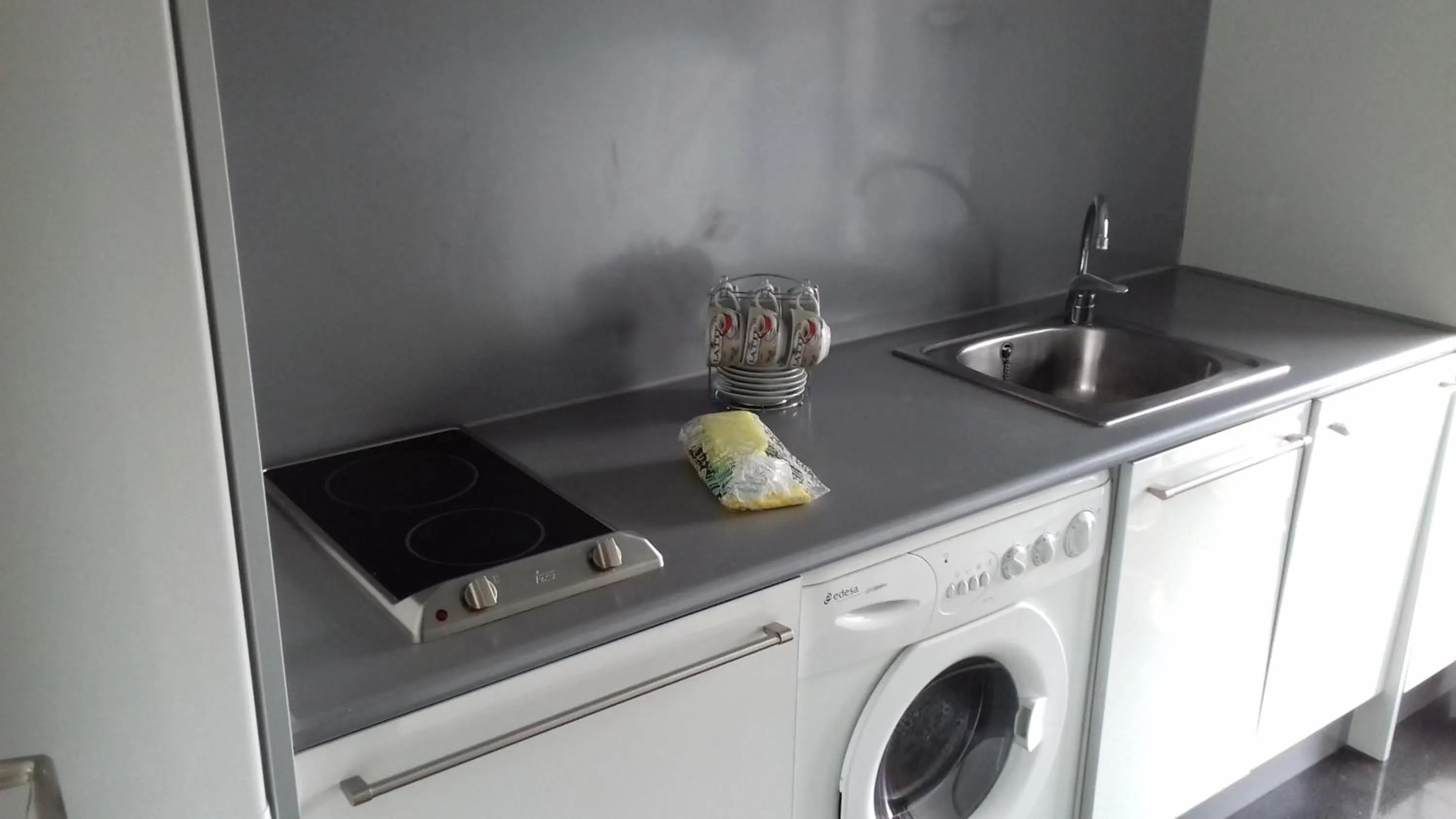 Kitchen or kitchenette in Apartamentos Turísticos Los Ángeles