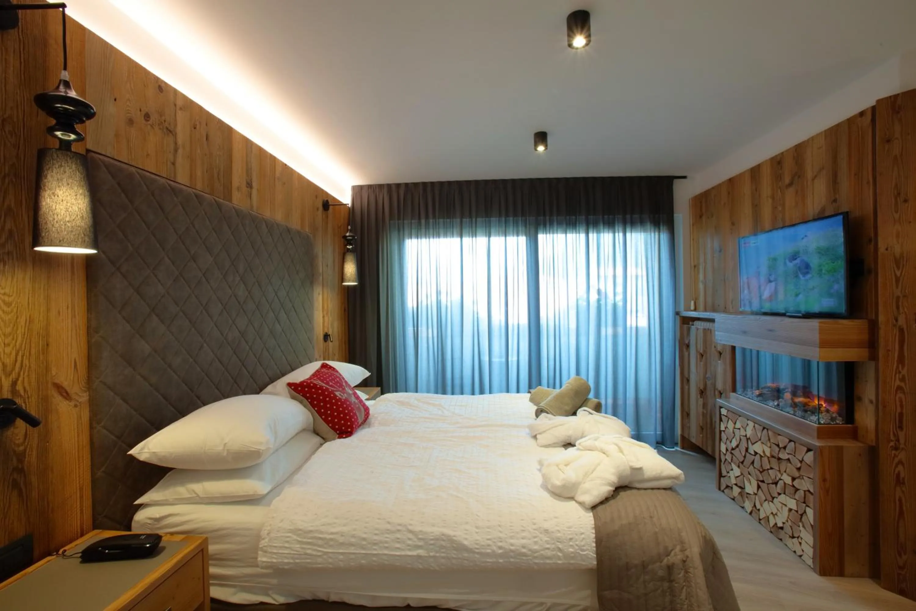 Bedroom, Bed in Alexander Hotel Alpine Wellness Dolomites