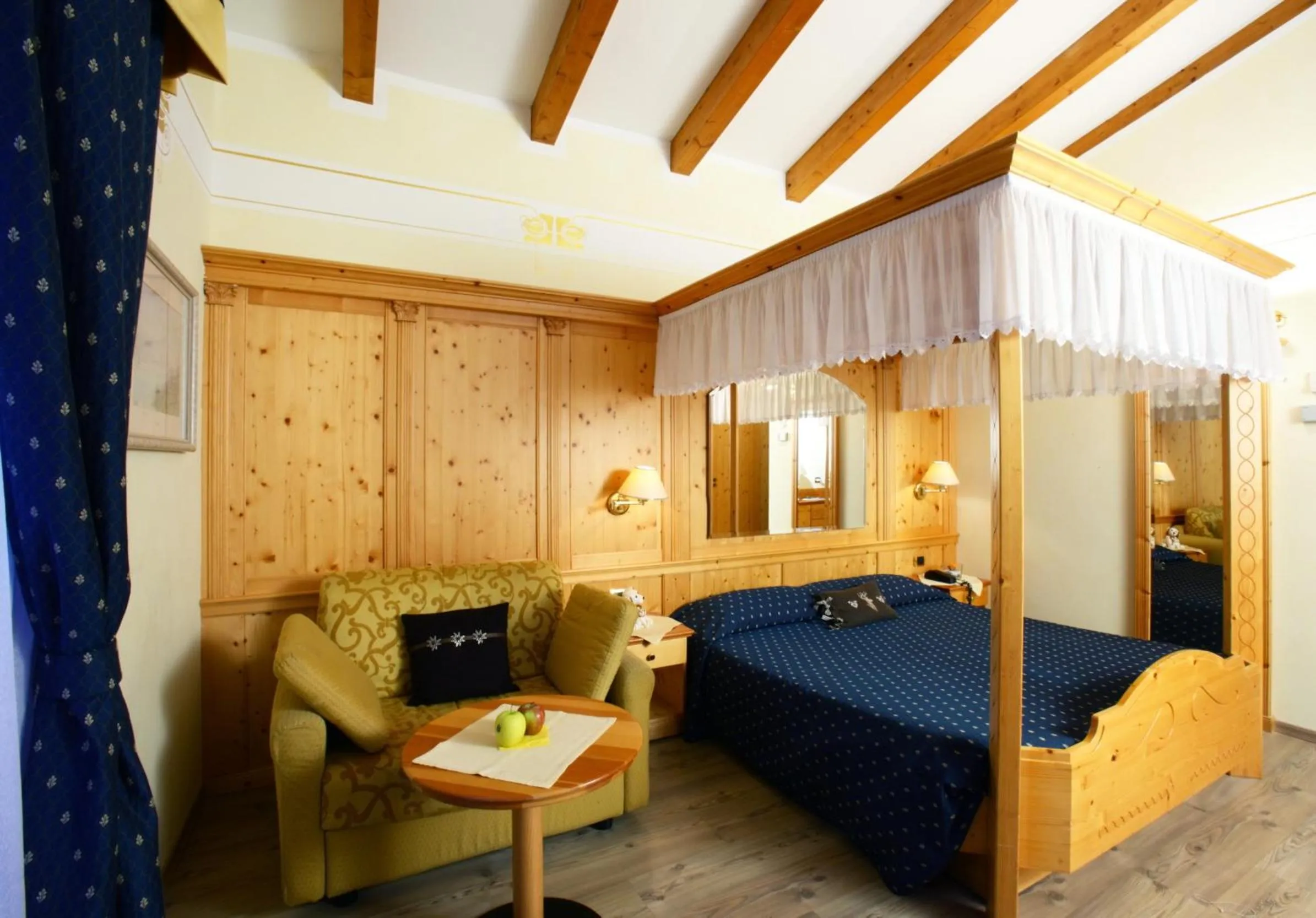 Photo of the whole room, Bed in Alexander Hotel Alpine Wellness Dolomites