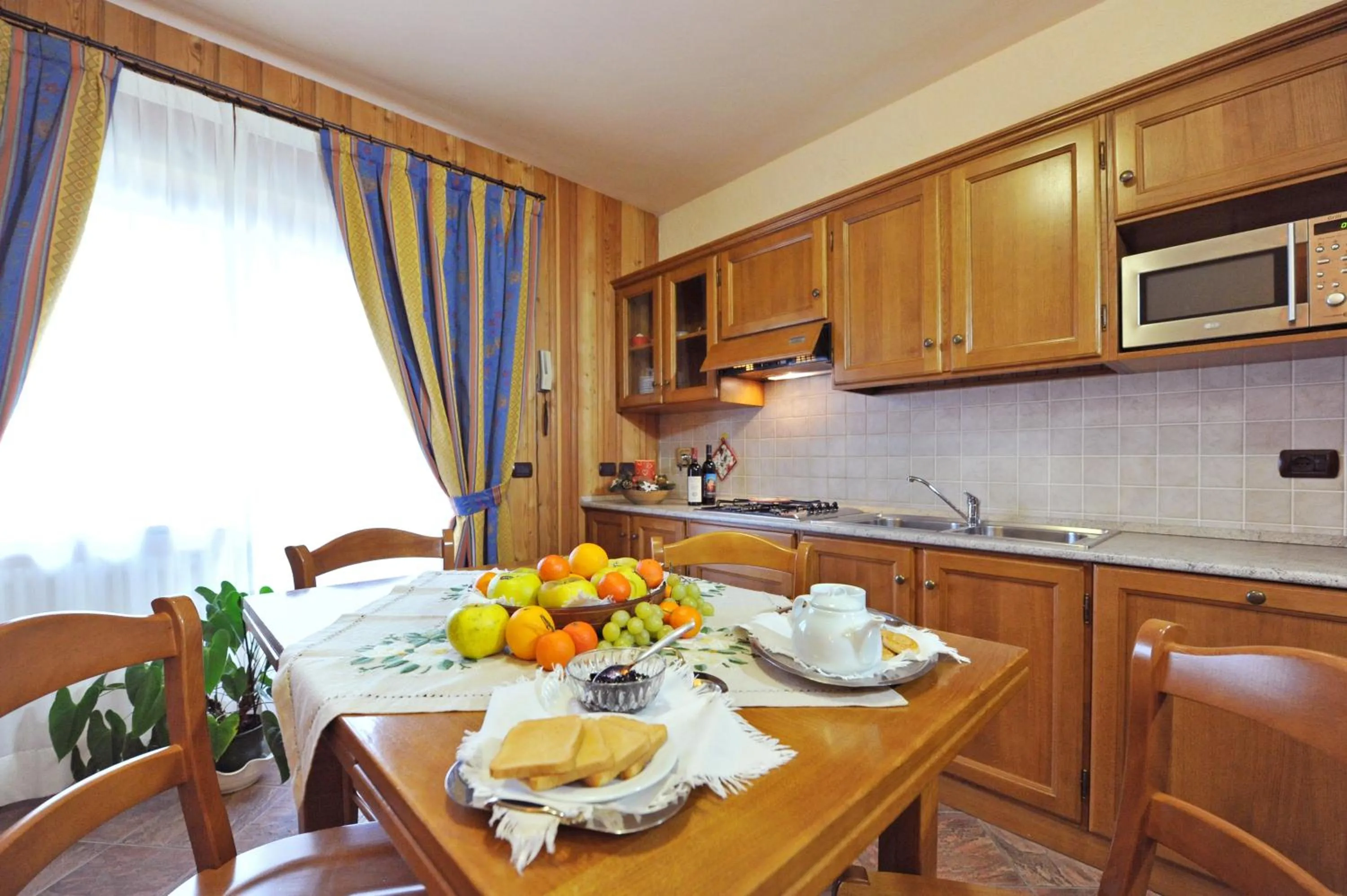 Kitchen or kitchenette in Family Apartments Le Chalet