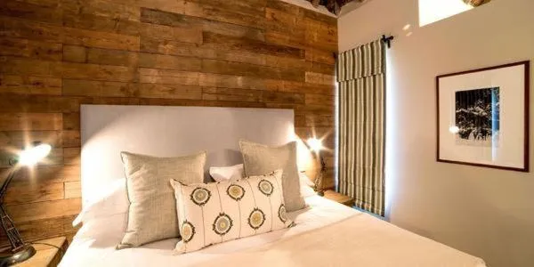 Bed in Burlington Bush Cottages by The Oyster Collection