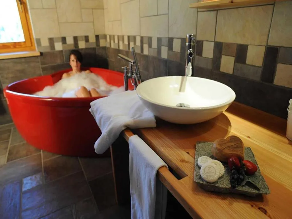 Hot Tub in La Madonnina Del Gran Paradiso Wellness Hotel