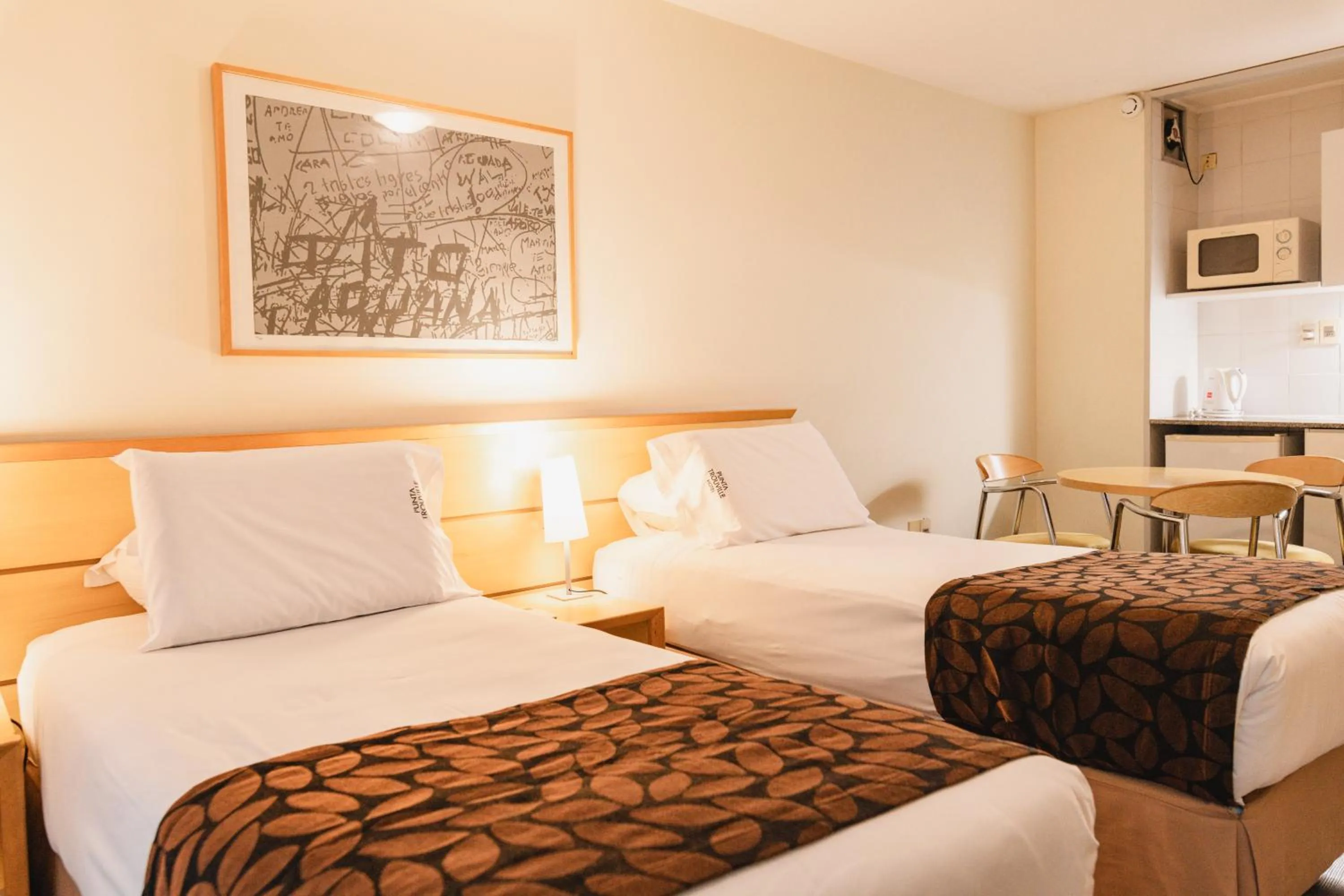 Photo of the whole room, Bed in Punta Trouville Hotel