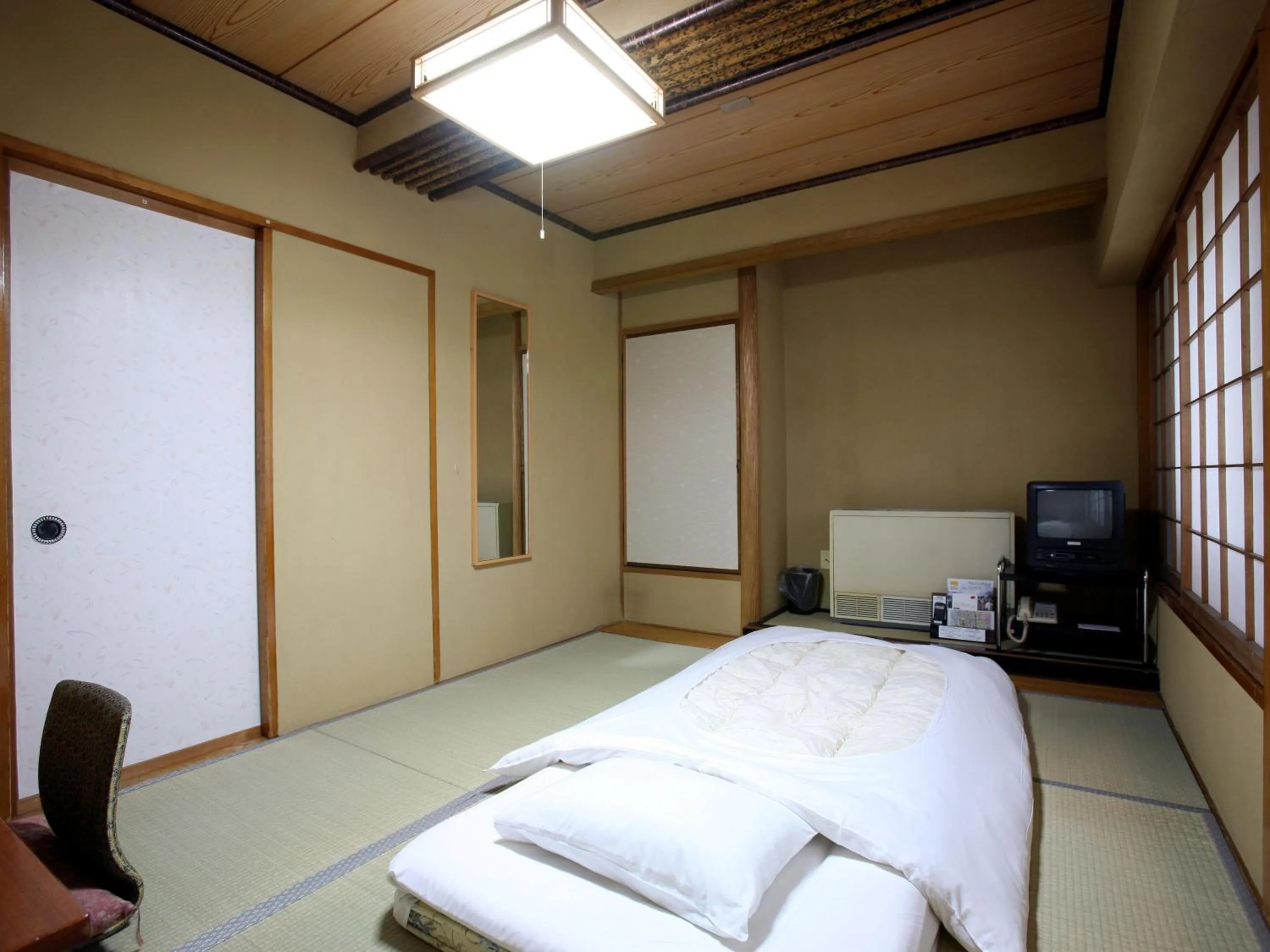 Bed in Takasaki Ekimae Plaza Hotel