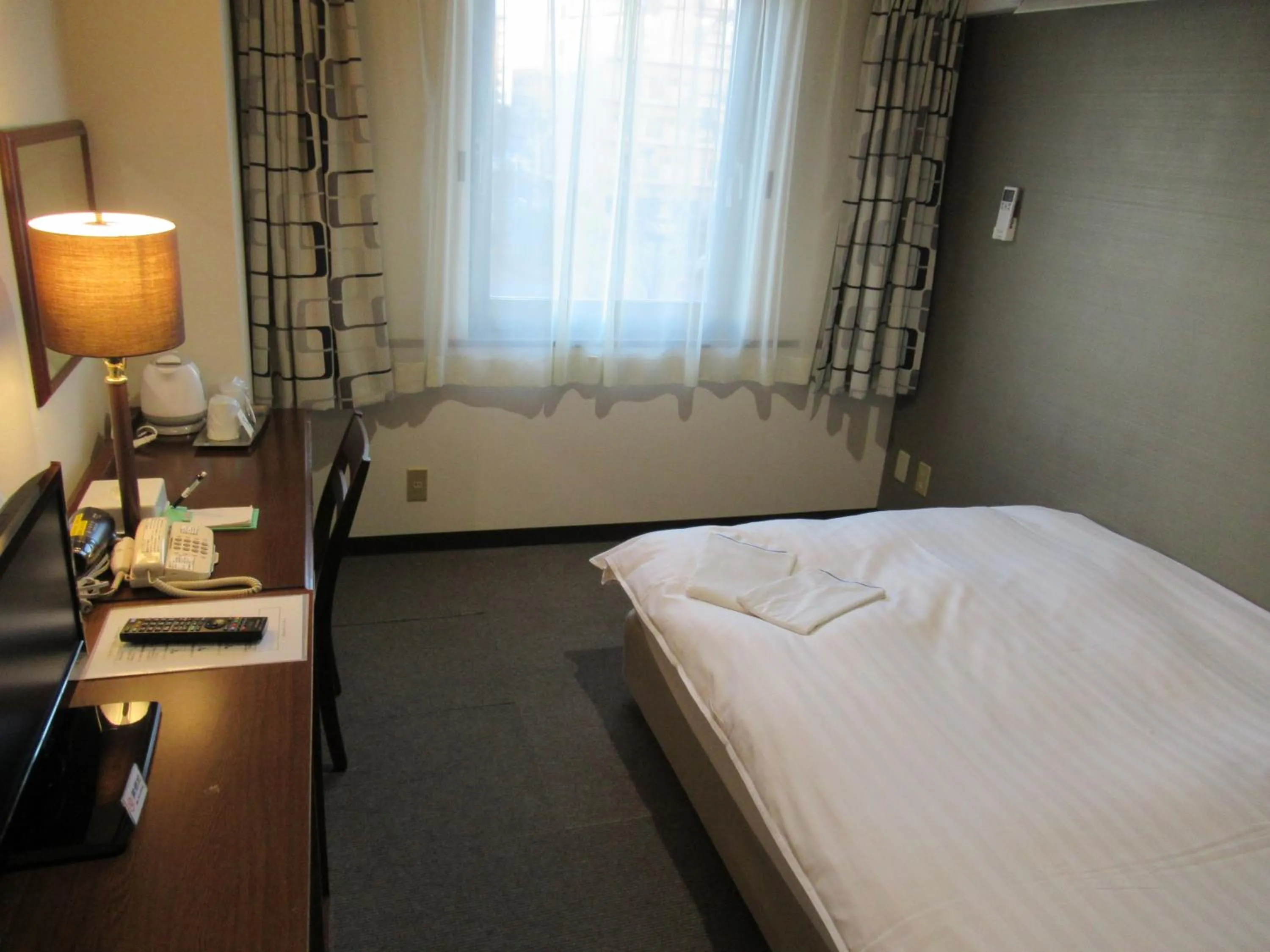 Photo of the whole room, Bed in Hotel Tomakomai Green Hills