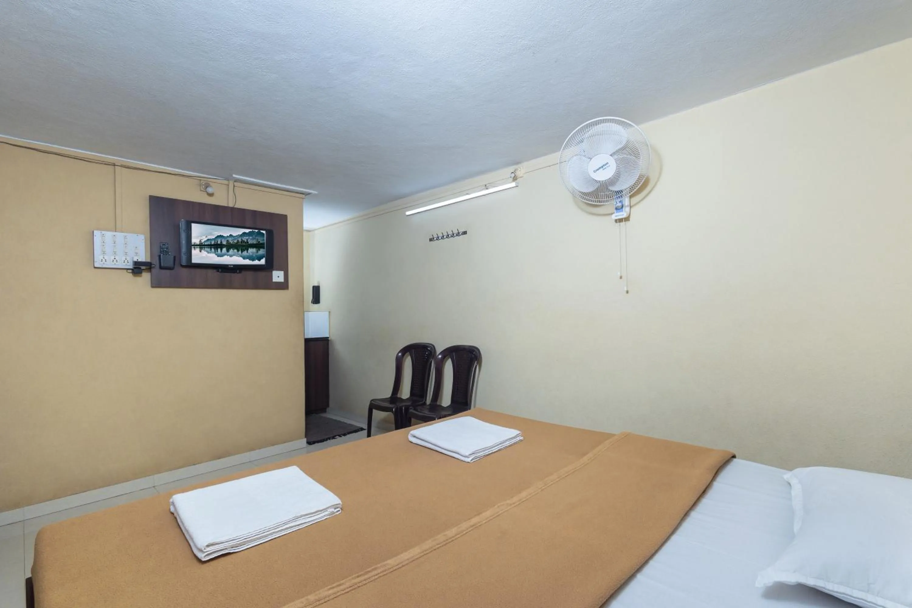 Bed in Hotel Ambika