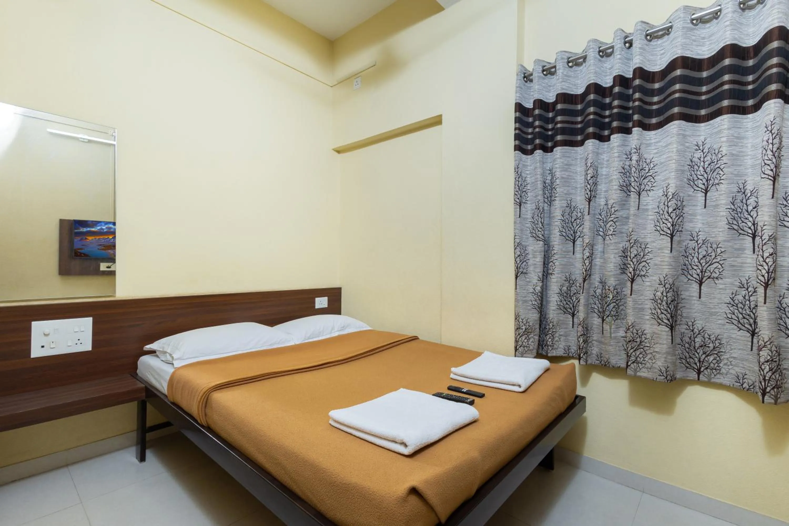 Bed in Hotel Ambika