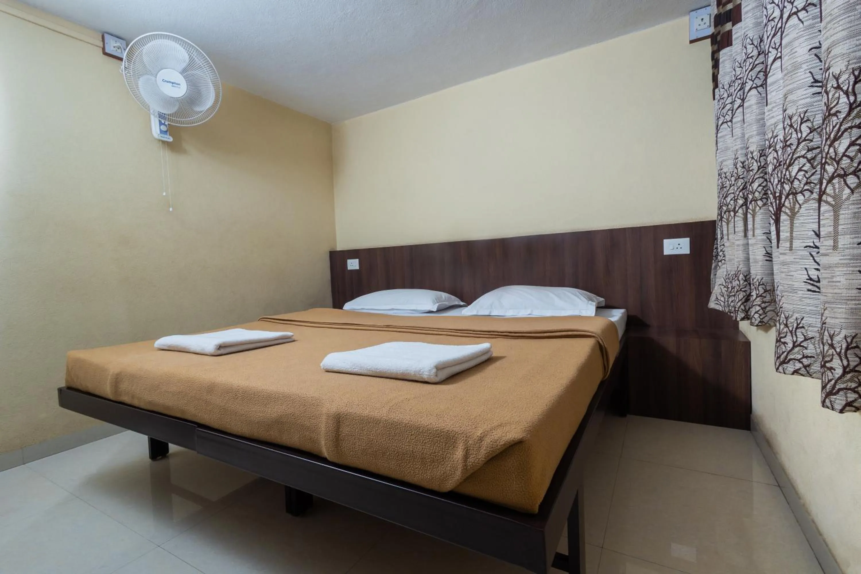Bed in Hotel Ambika