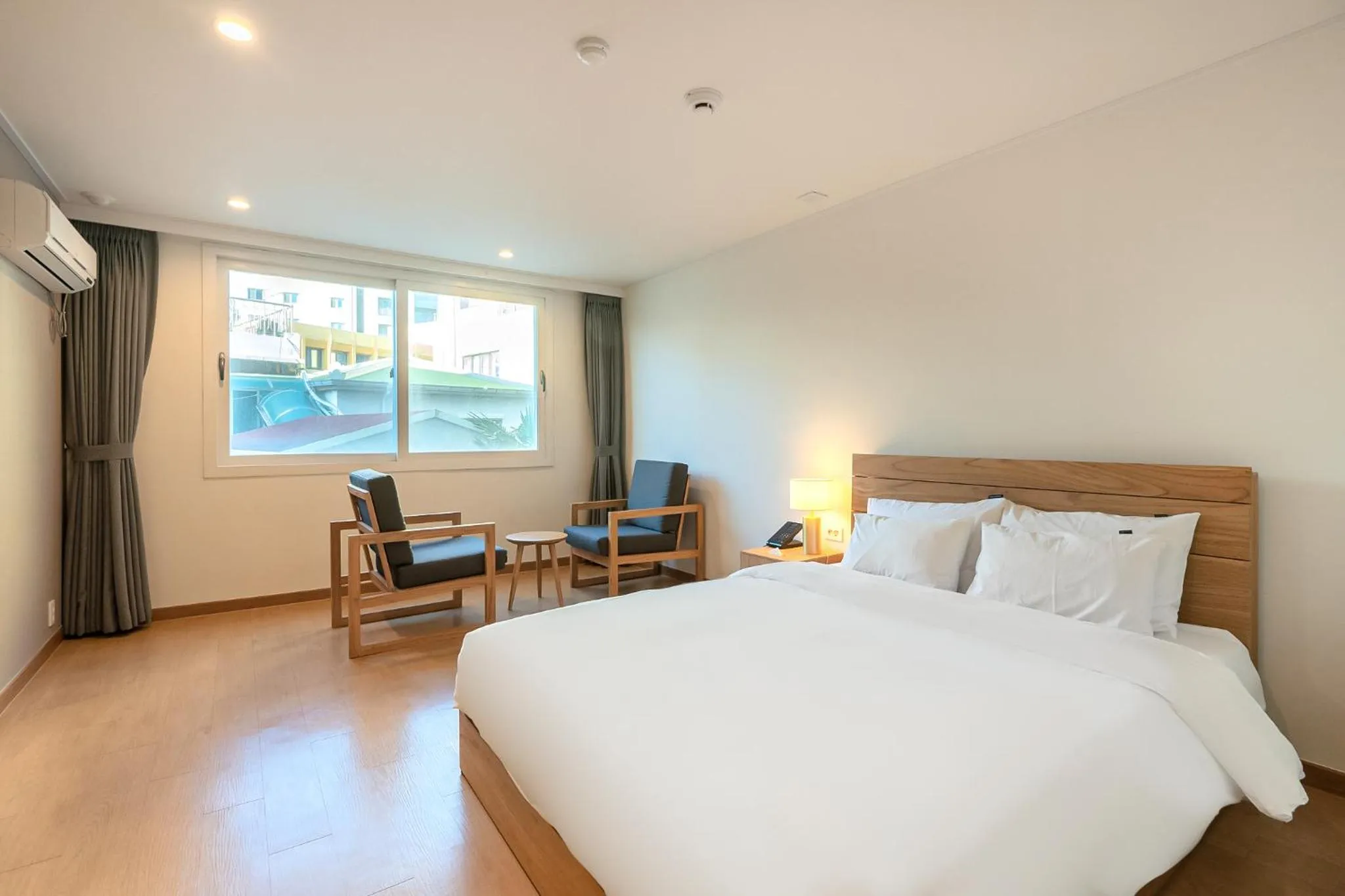 Bed in Heyy Seogwipo Hotel