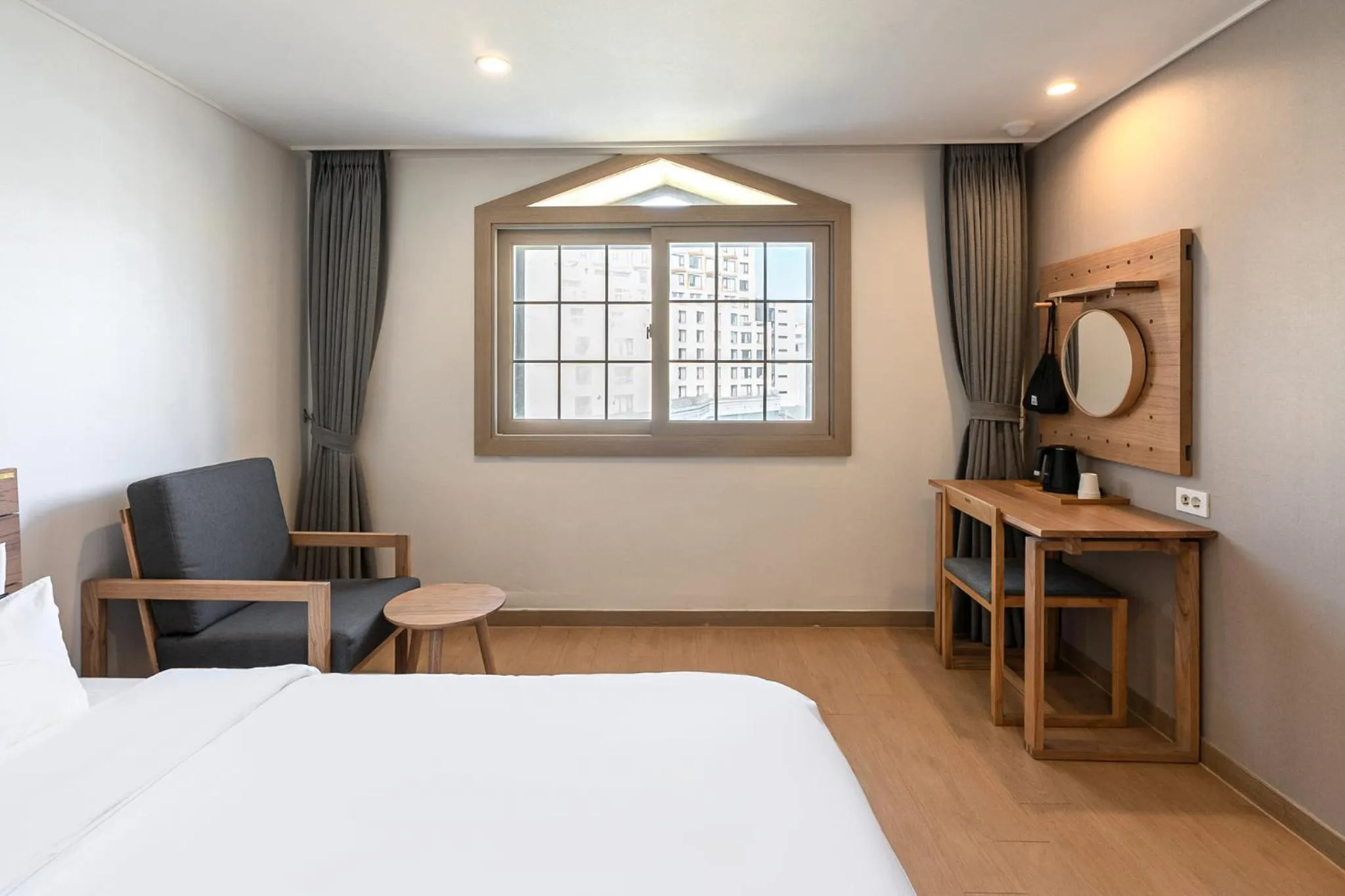 Bed in Heyy Seogwipo Hotel