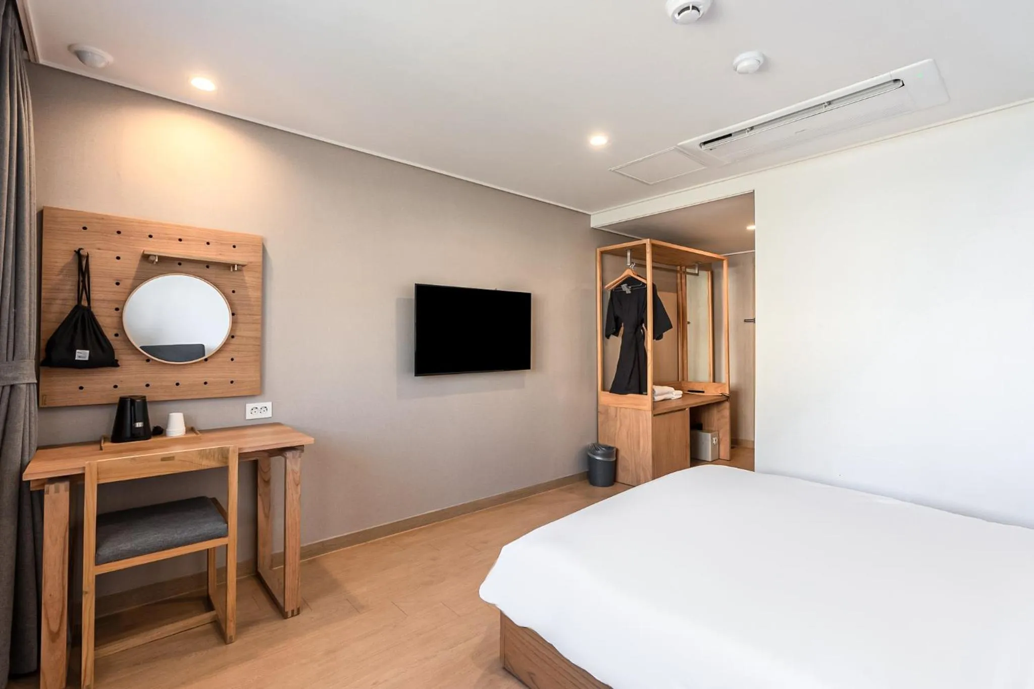 Bed in Heyy Seogwipo Hotel