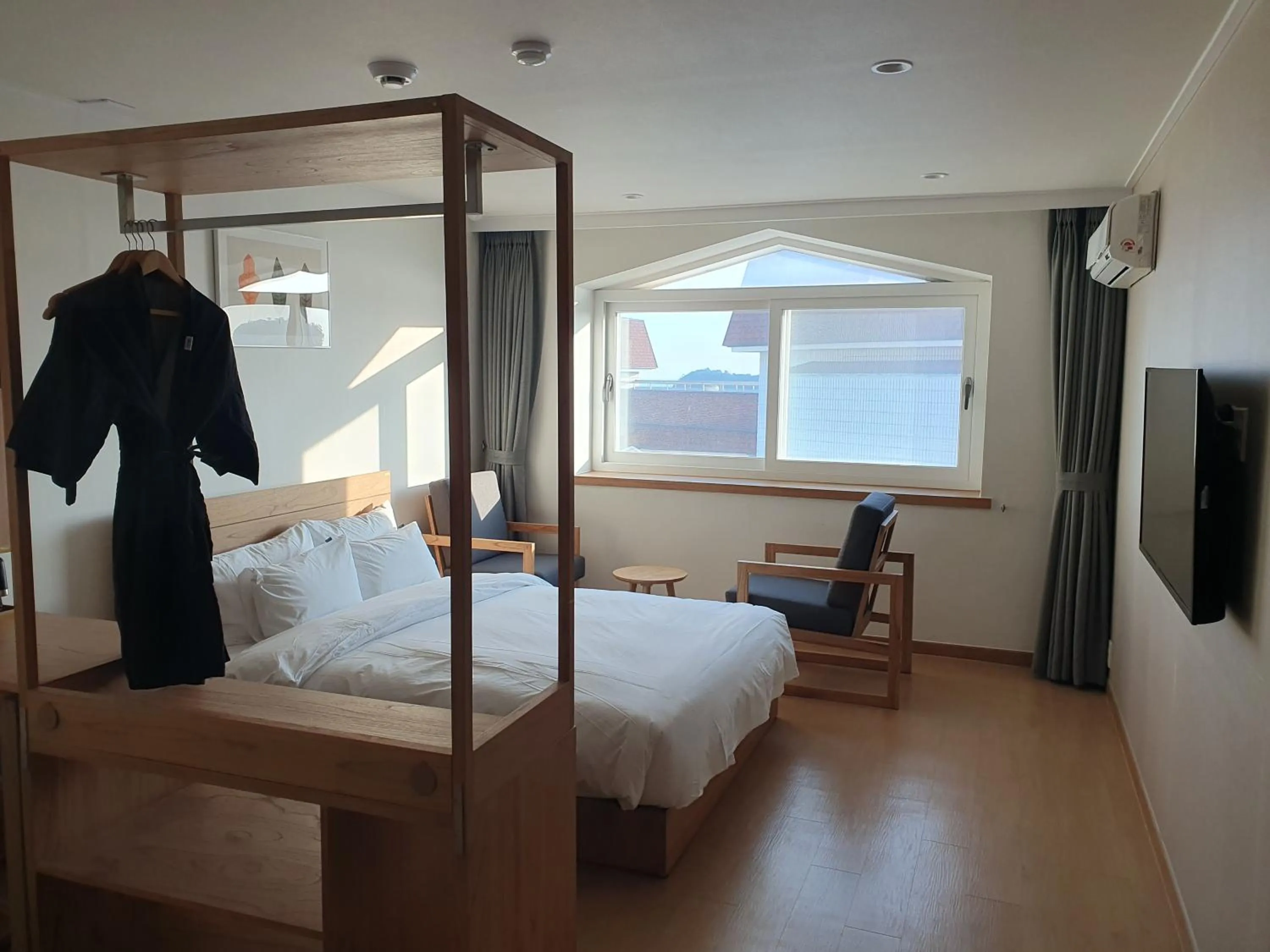 Bed in Heyy Seogwipo Hotel