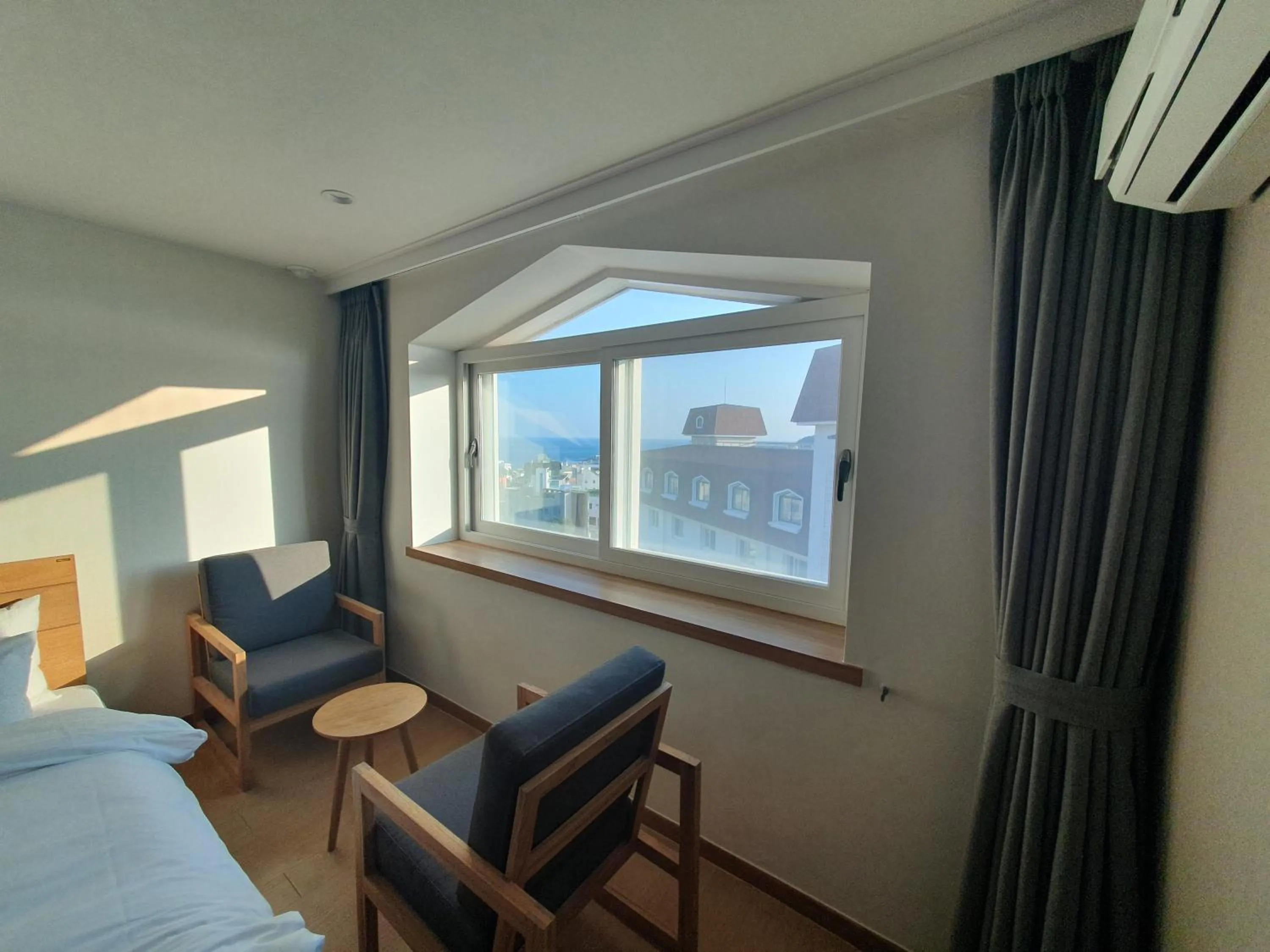 Bed in Heyy Seogwipo Hotel