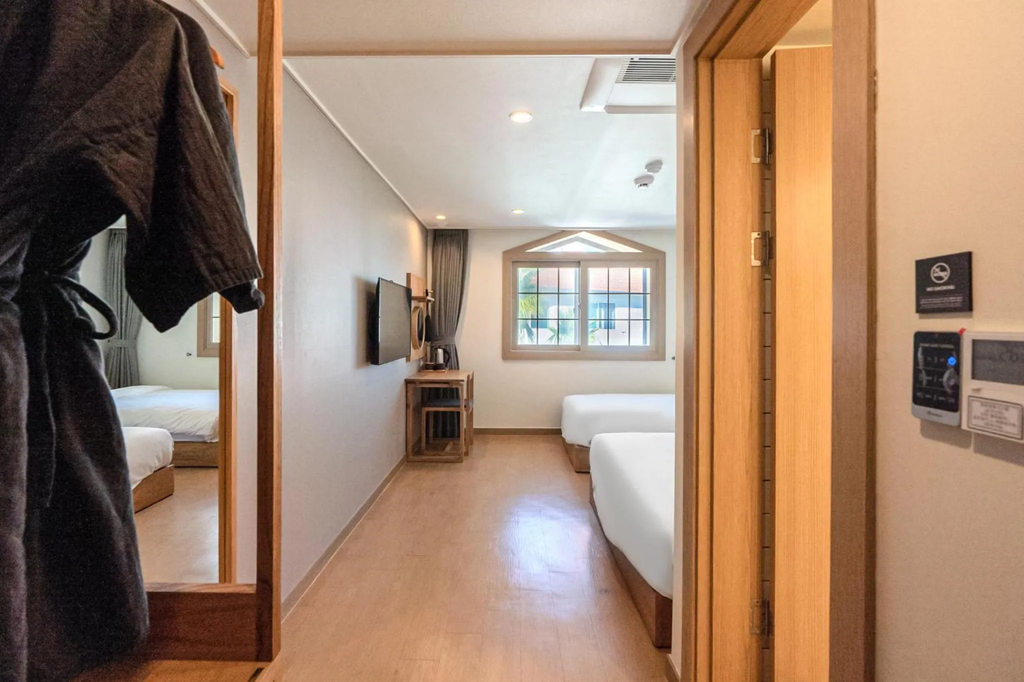 Bed in Heyy Seogwipo Hotel