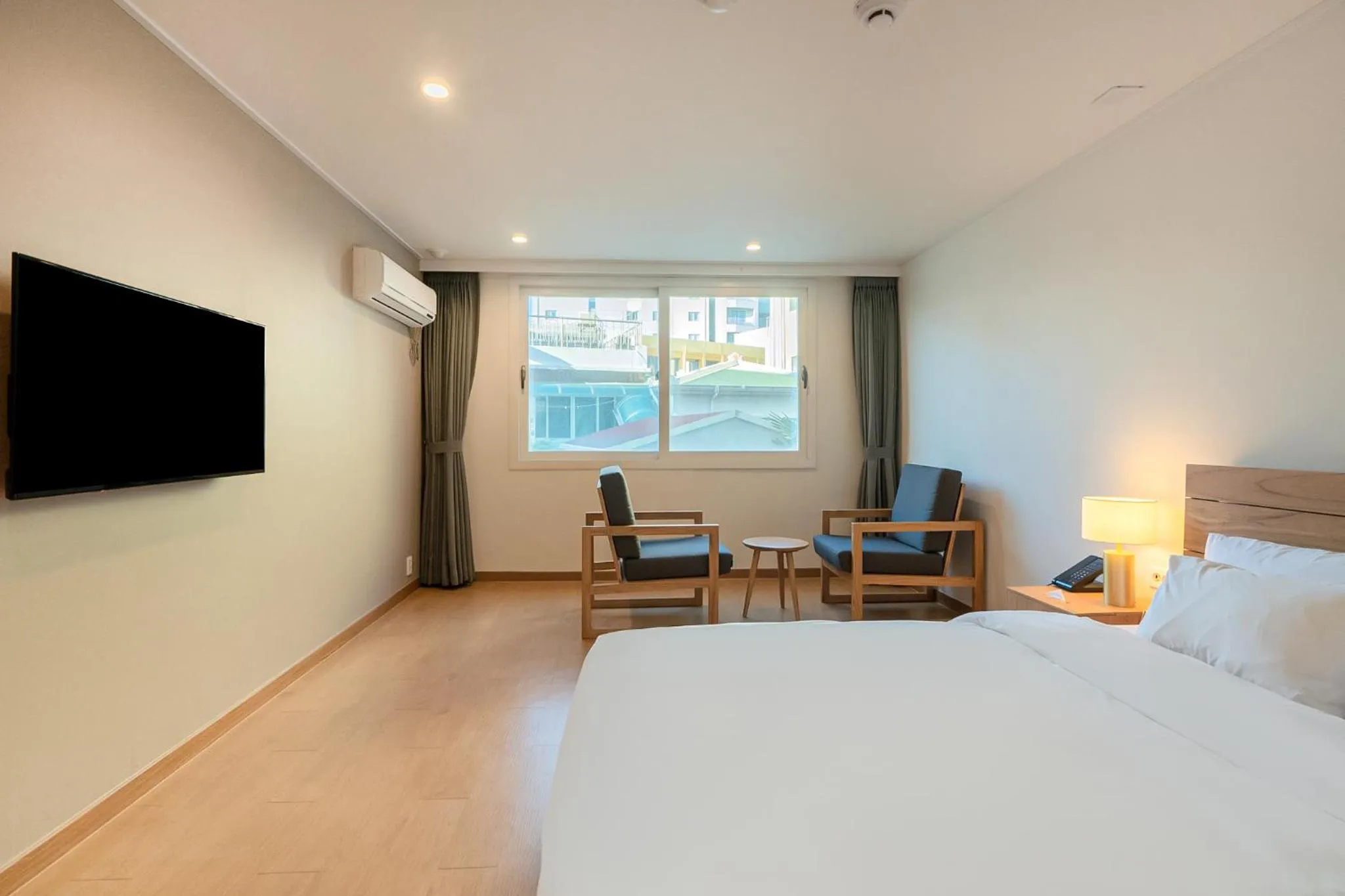 Bed in Heyy Seogwipo Hotel