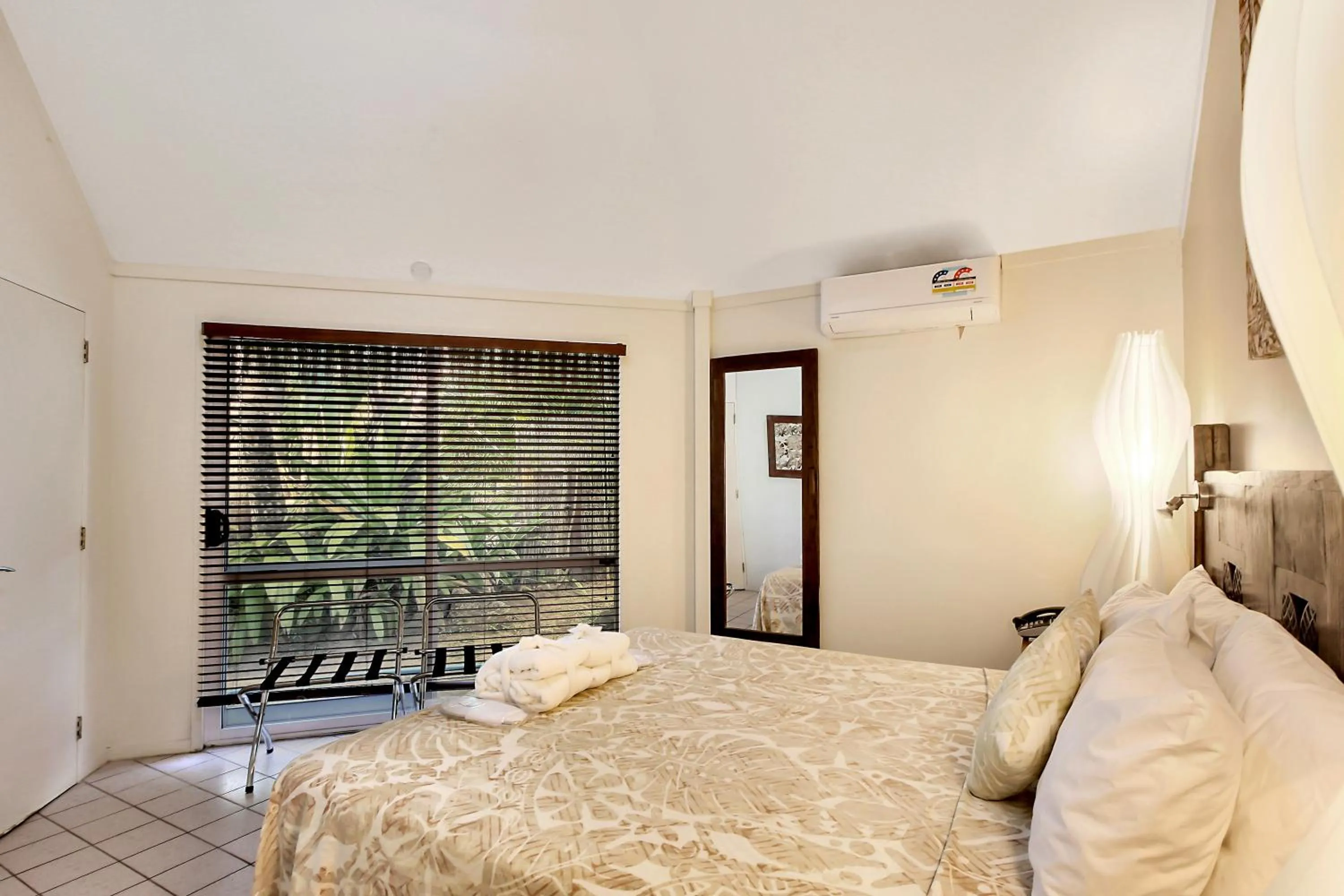 Bed in Crown Beach Resort & Spa