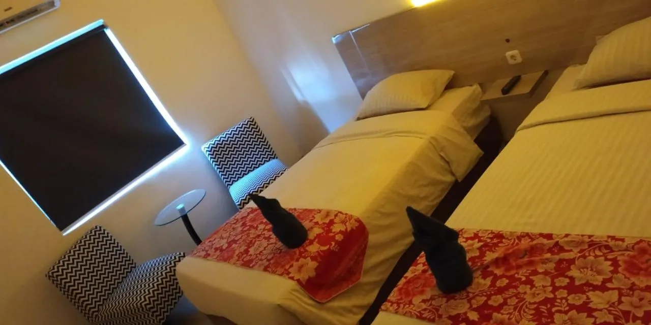 Bed in Mel's Inn Manado